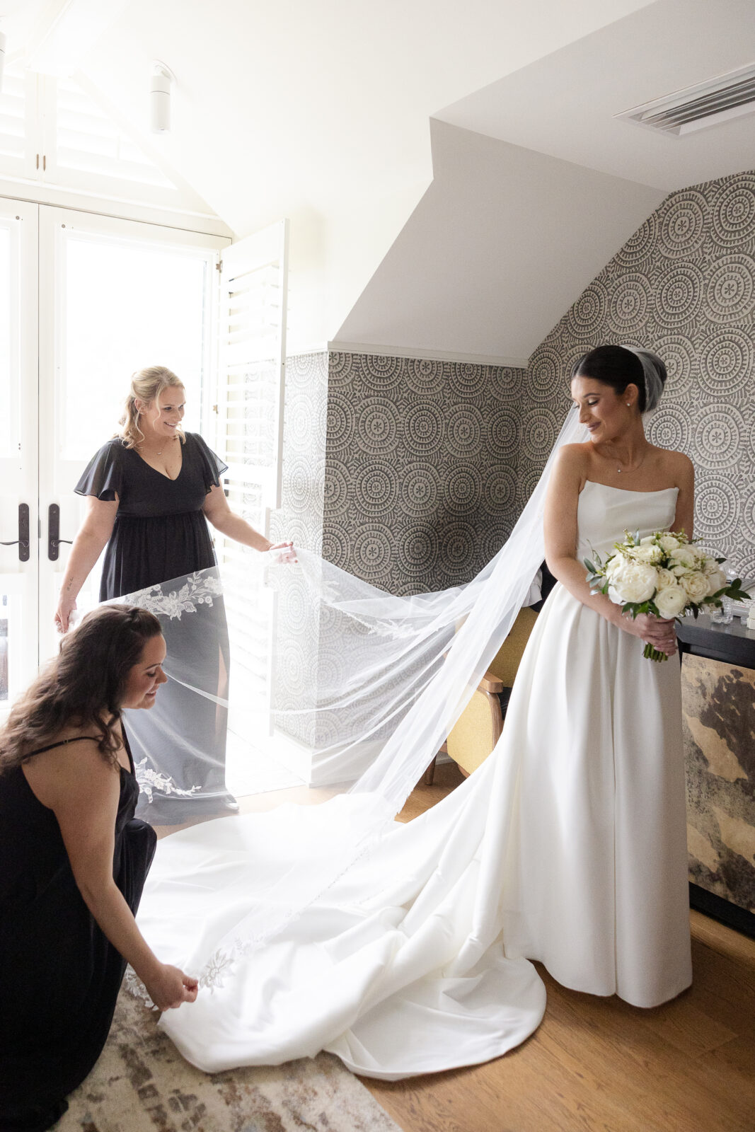 Bride with her bridesmaid at bridal suite
