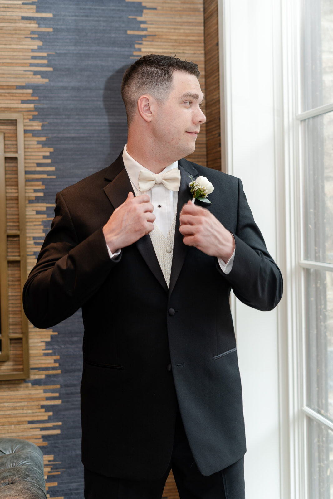 Groom getting dressed