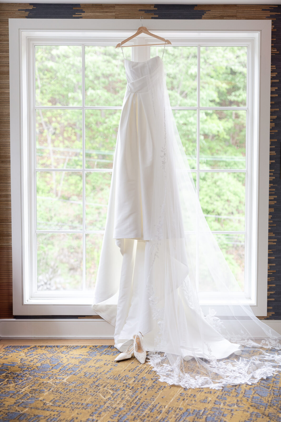 Wedding dress hung up on a window for NJ bride
