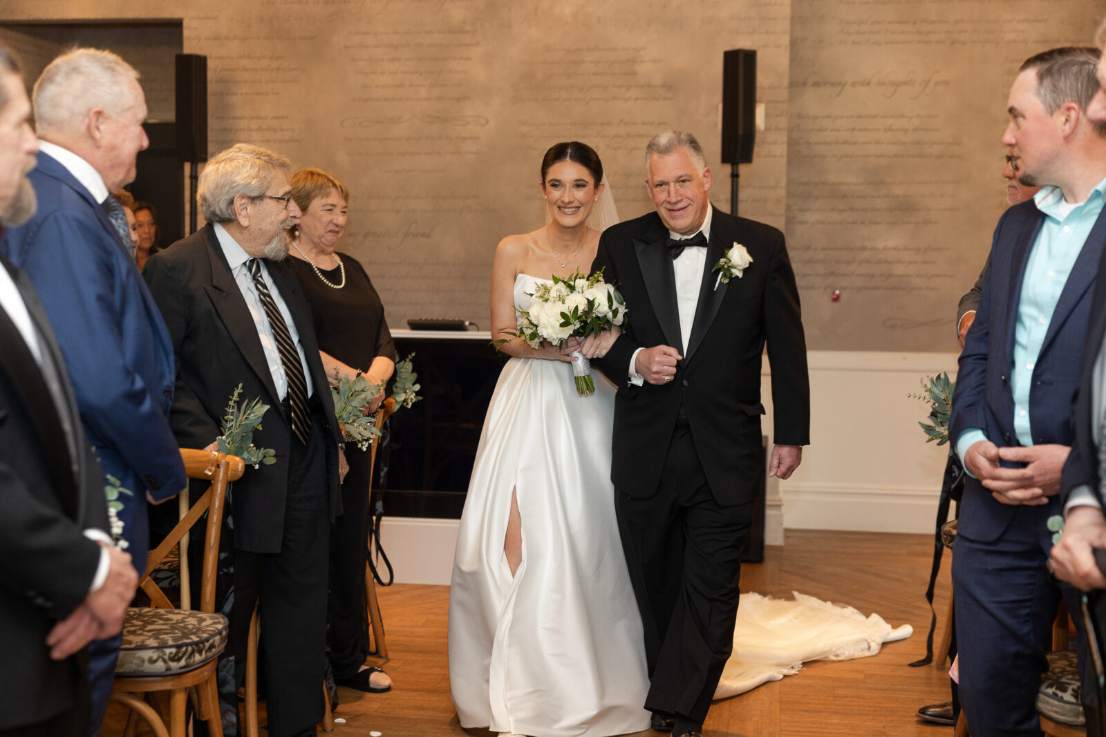 Bride walking in aisle with dad