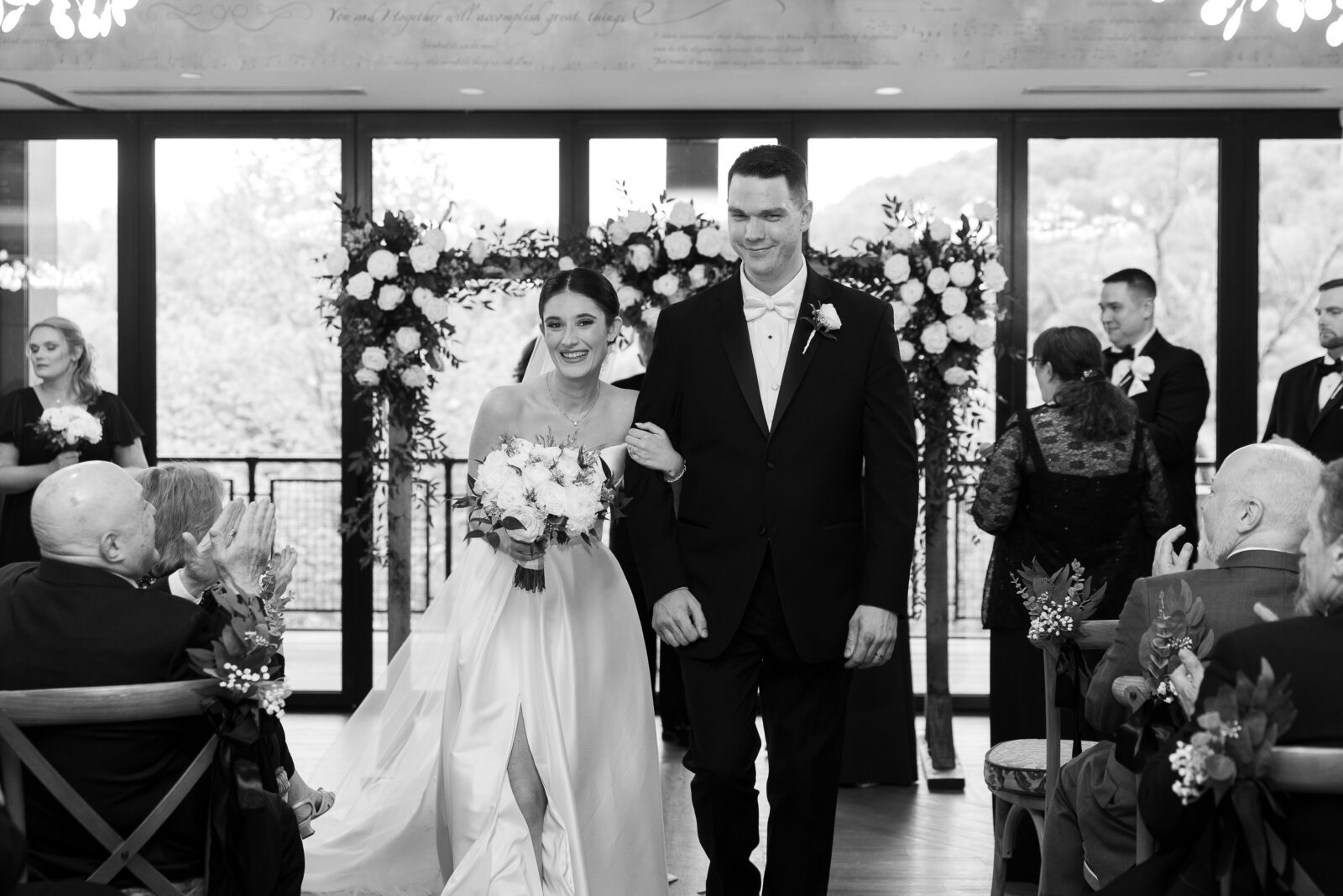 Bride and Groom first kiss at wedding aisle