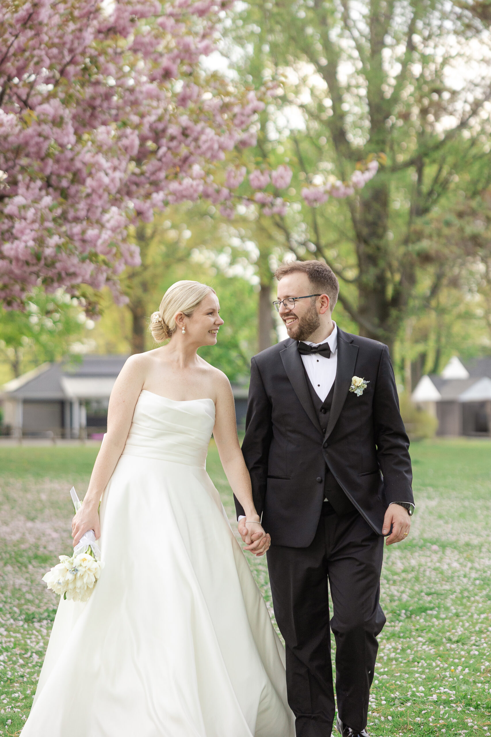 Bride and groom spring cherry blossoms wedding portraits at VIP Country Club Wedding