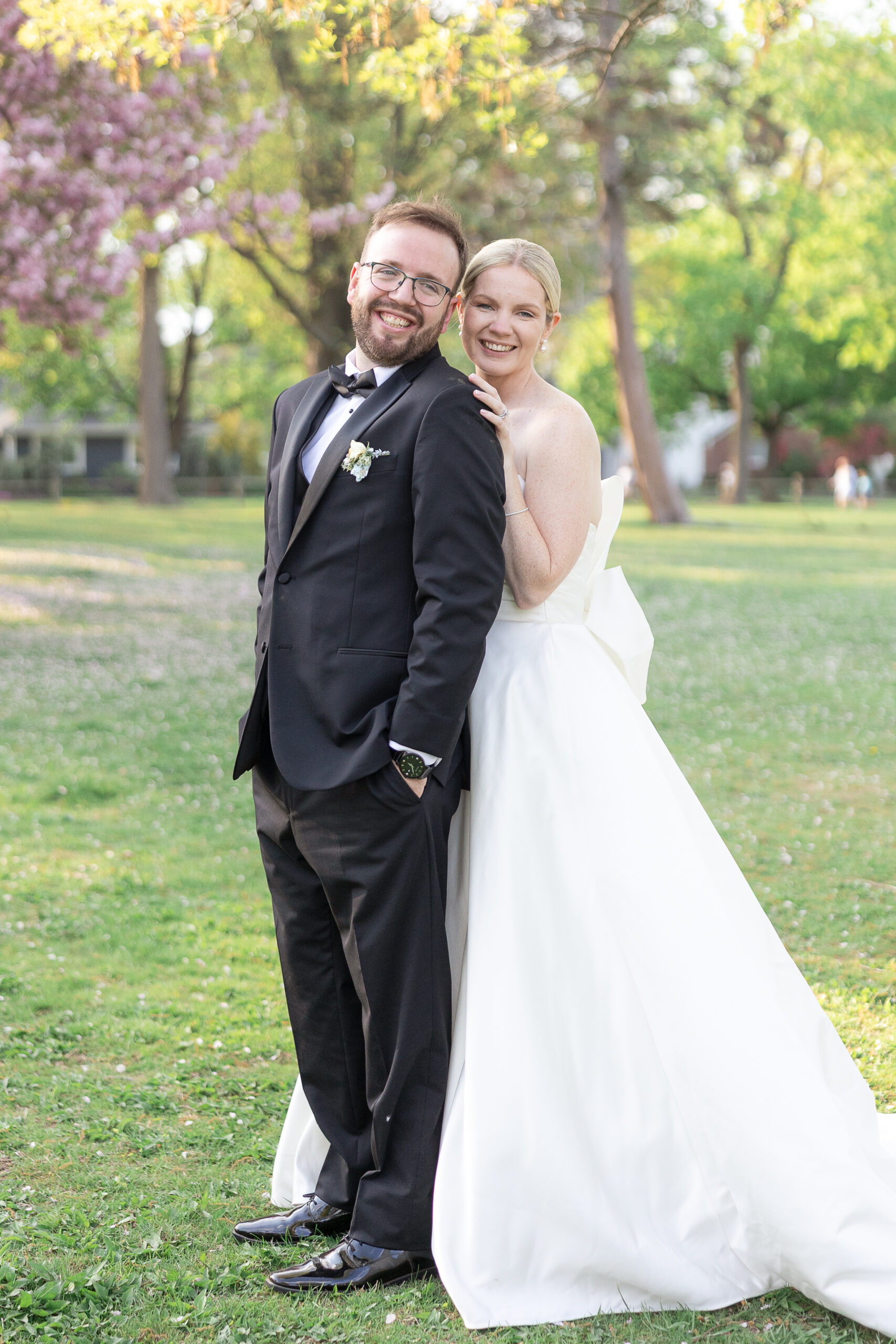 Bride and groom spring cherry blossoms wedding portraits at VIP Country Club Wedding