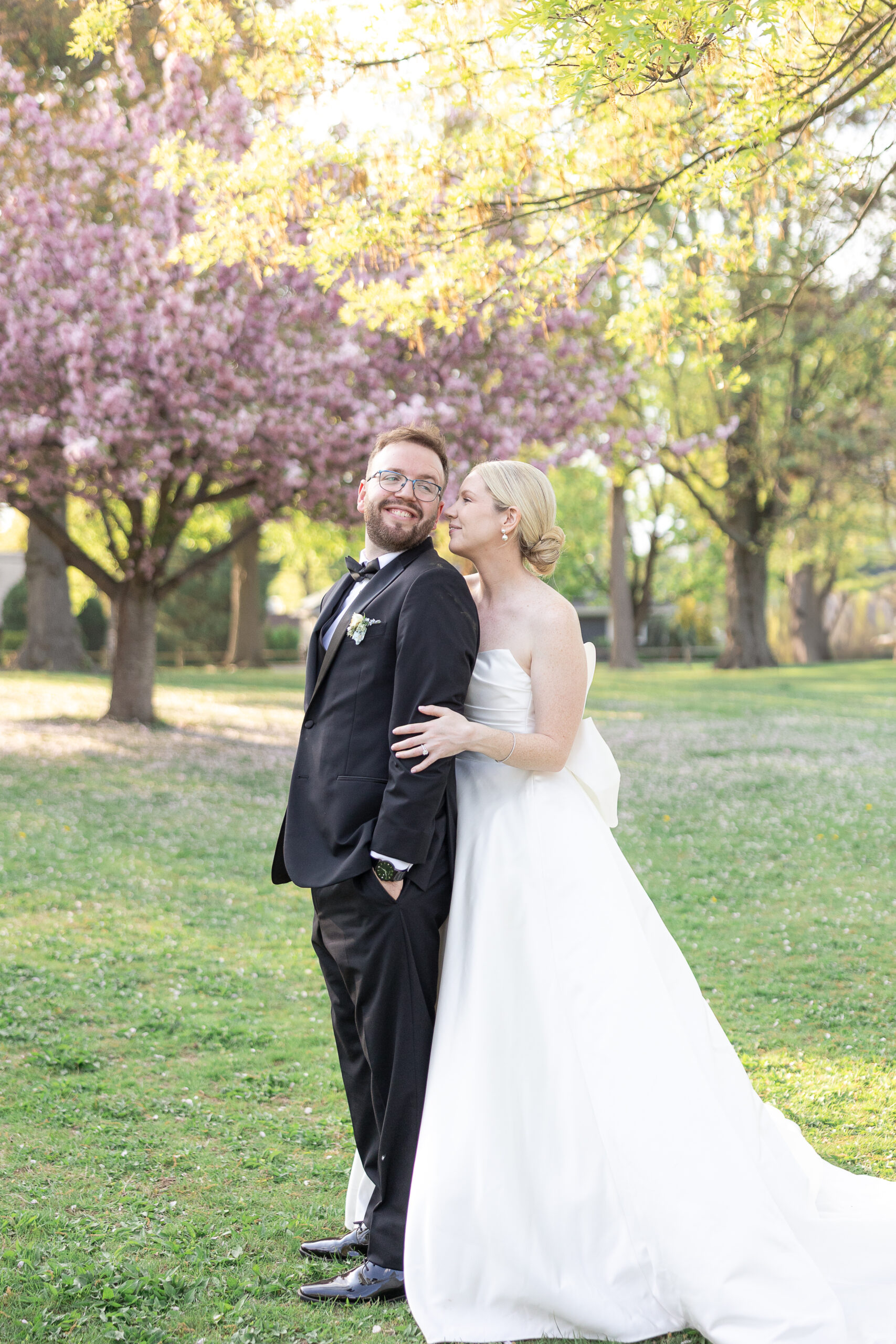 Bride and groom spring cherry blossoms wedding portraits at VIP Country Club Wedding