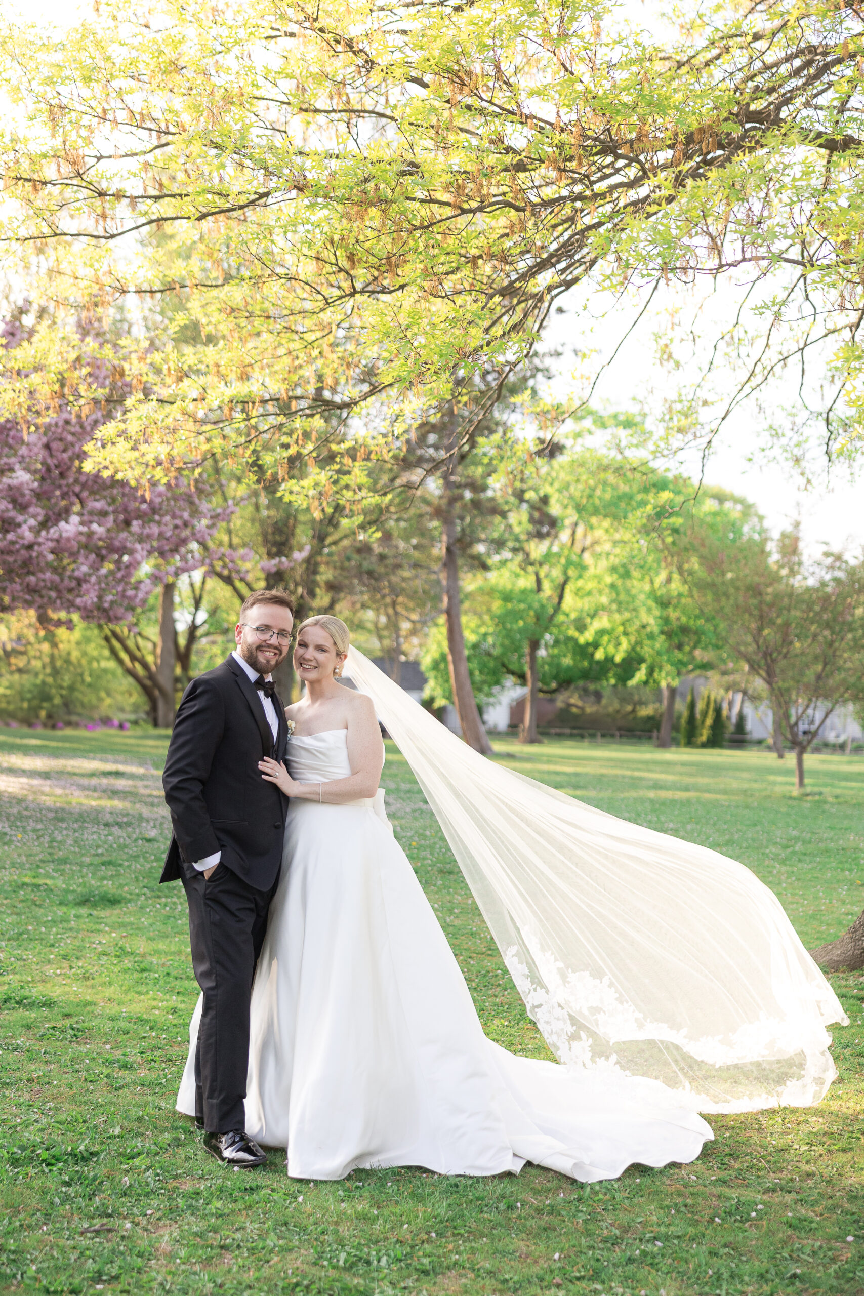 Bride and groom spring cherry blossoms wedding portraits at VIP Country Club Wedding