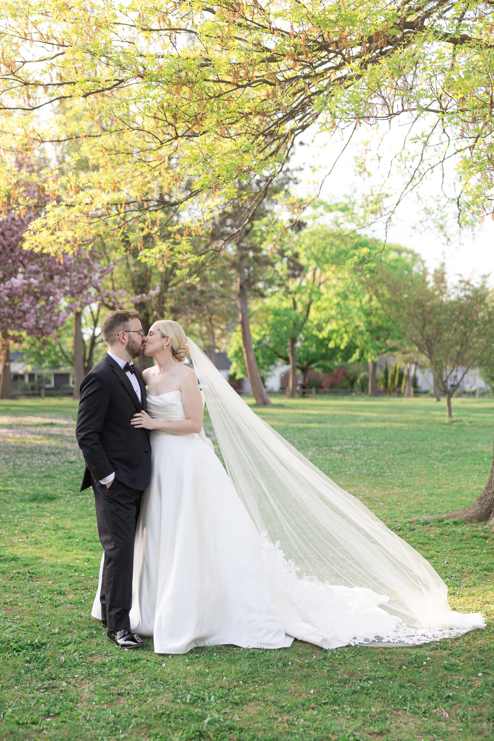 Bride and groom spring cherry blossoms wedding portraits at VIP Country Club Wedding