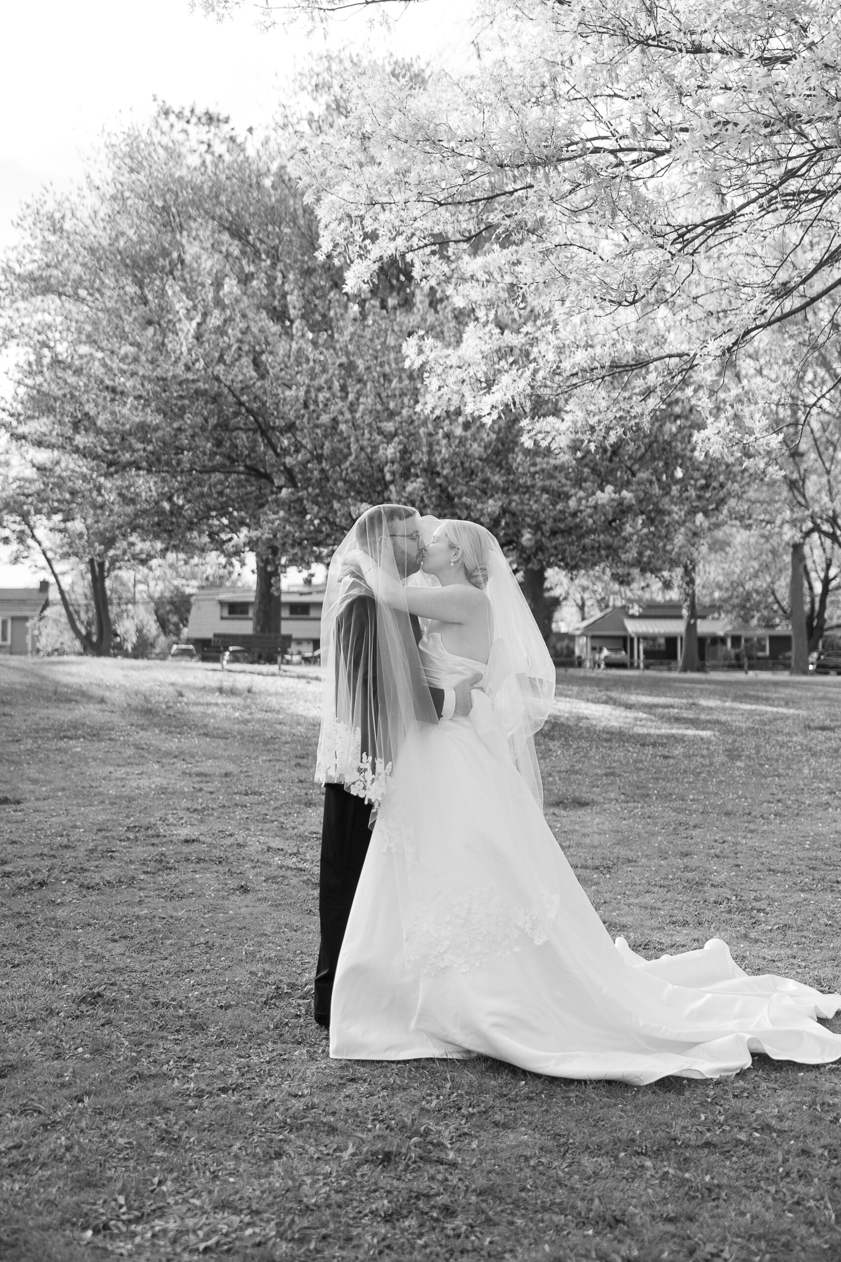 Bride and groom spring cherry blossoms wedding portraits at VIP Country Club Wedding