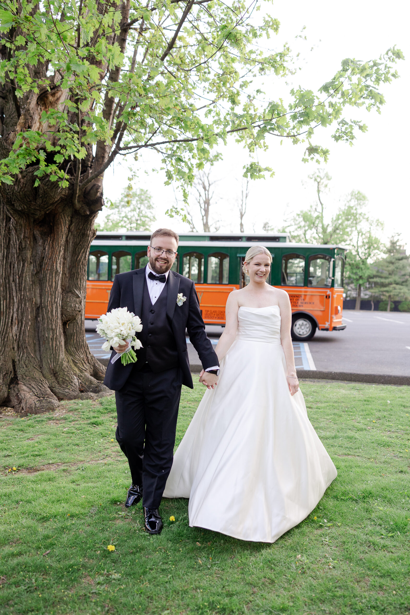 Bride and groom in front of wedding trolley