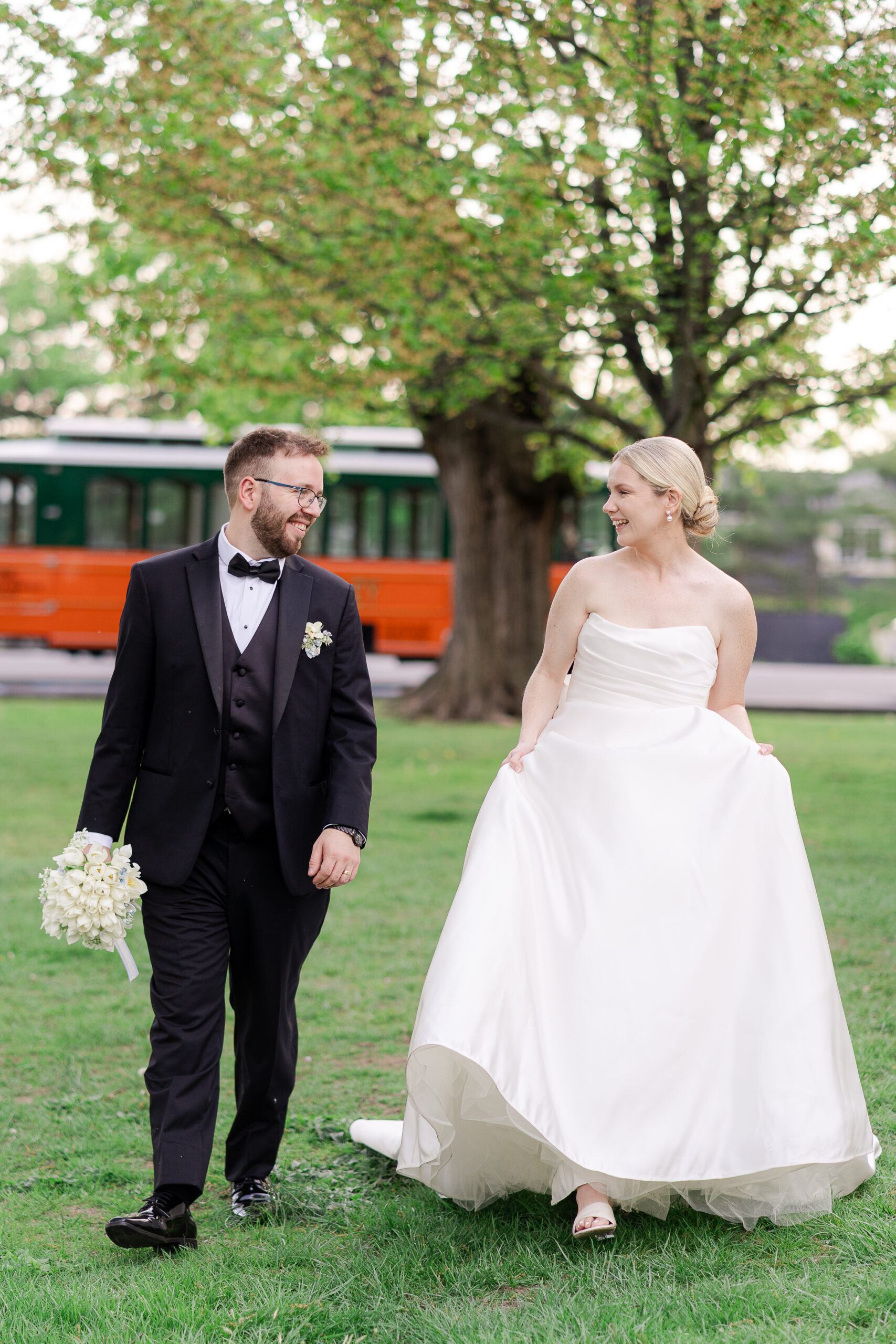 Bride and groom in front of wedding trolley