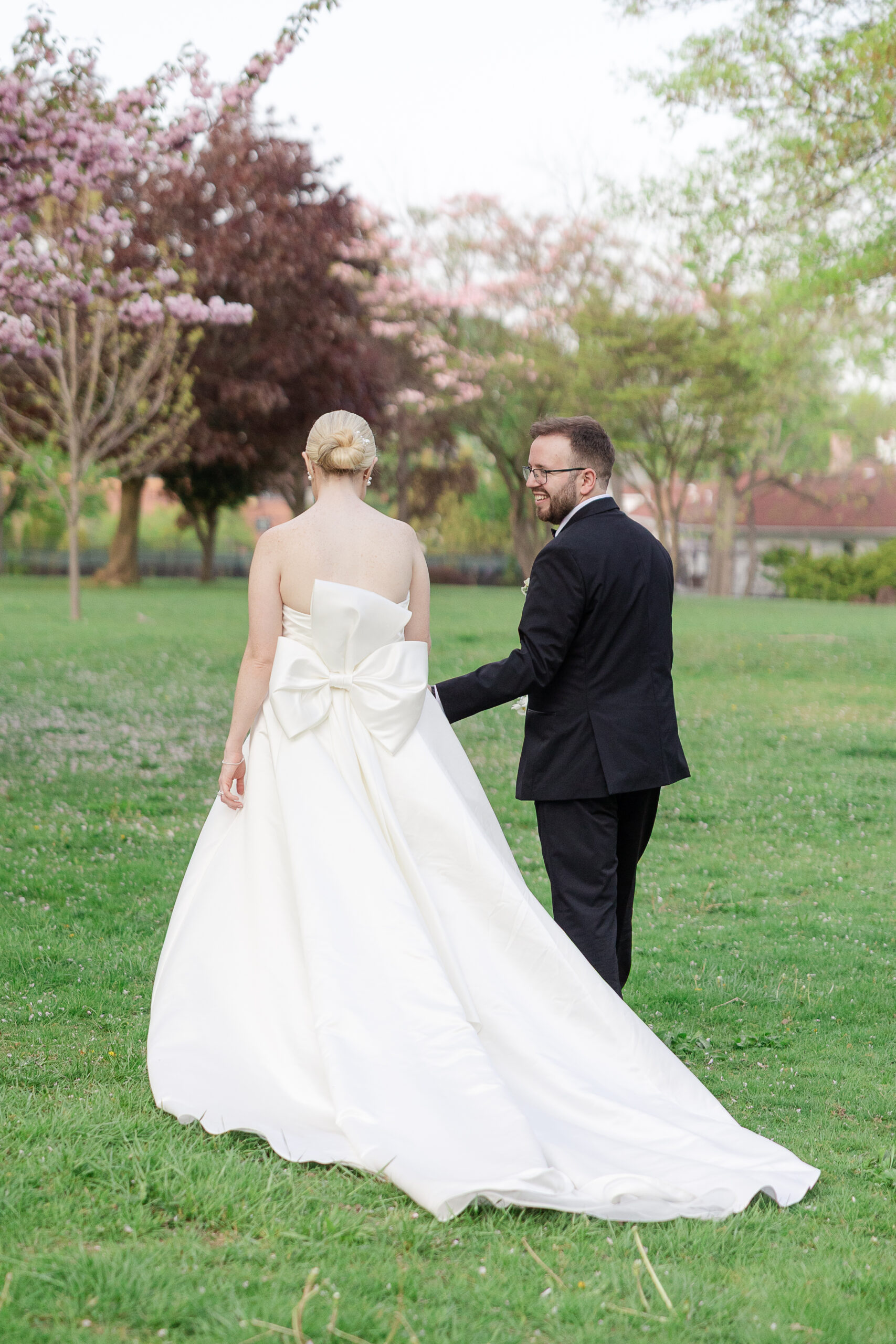 Bride and groom candid moment walking through VIP Country Club Wedding