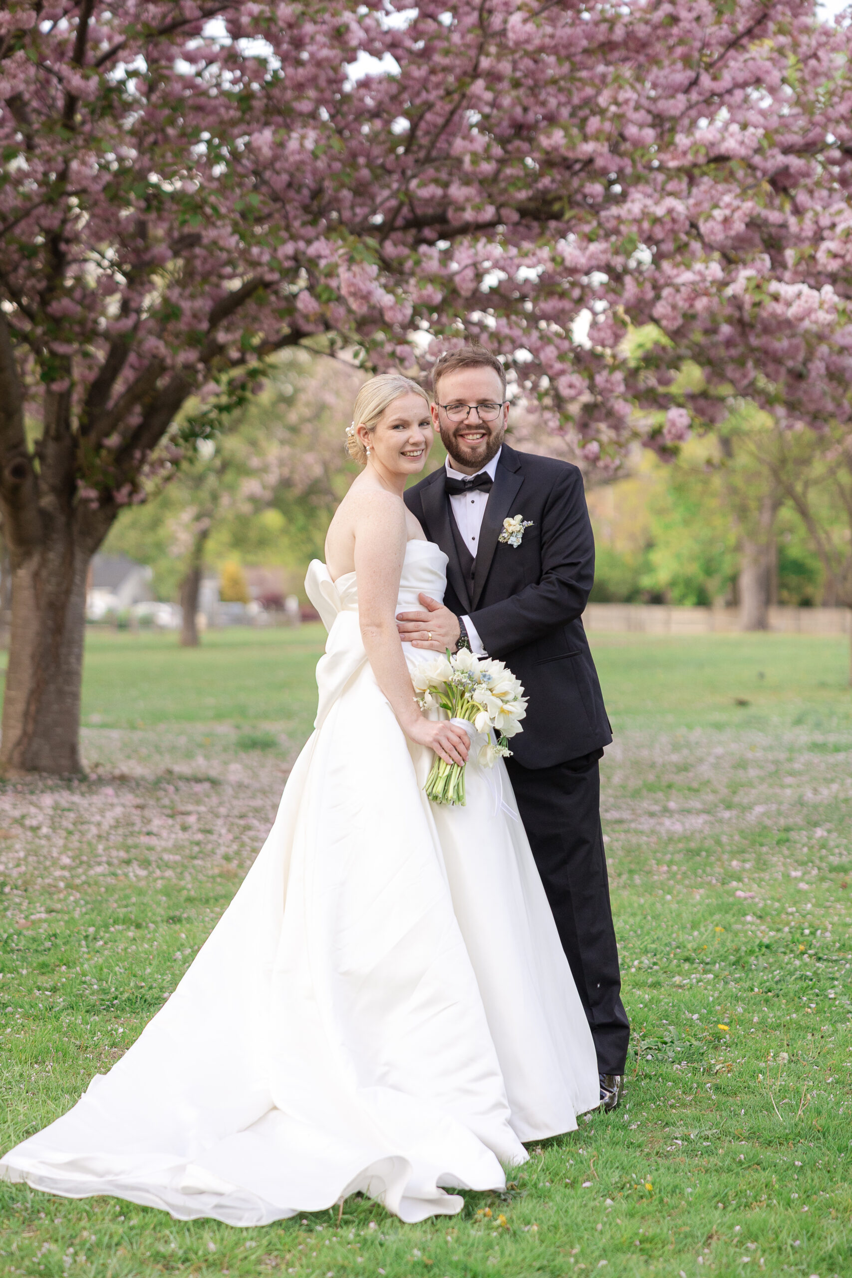Bride and groom spring cherry blossoms wedding portraits at VIP Country Club Wedding