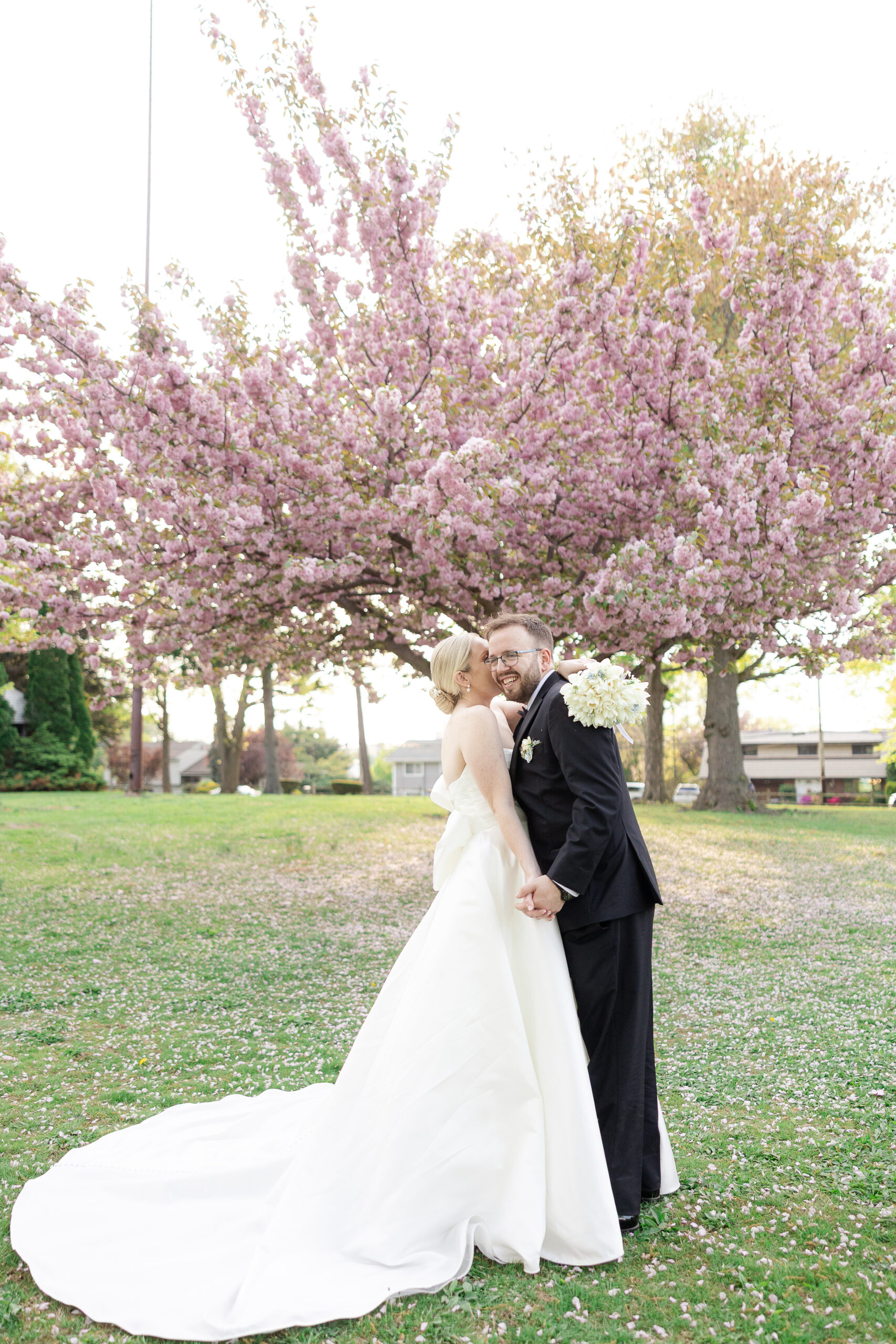 Bride and groom spring cherry blossoms wedding portraits at VIP Country Club Wedding