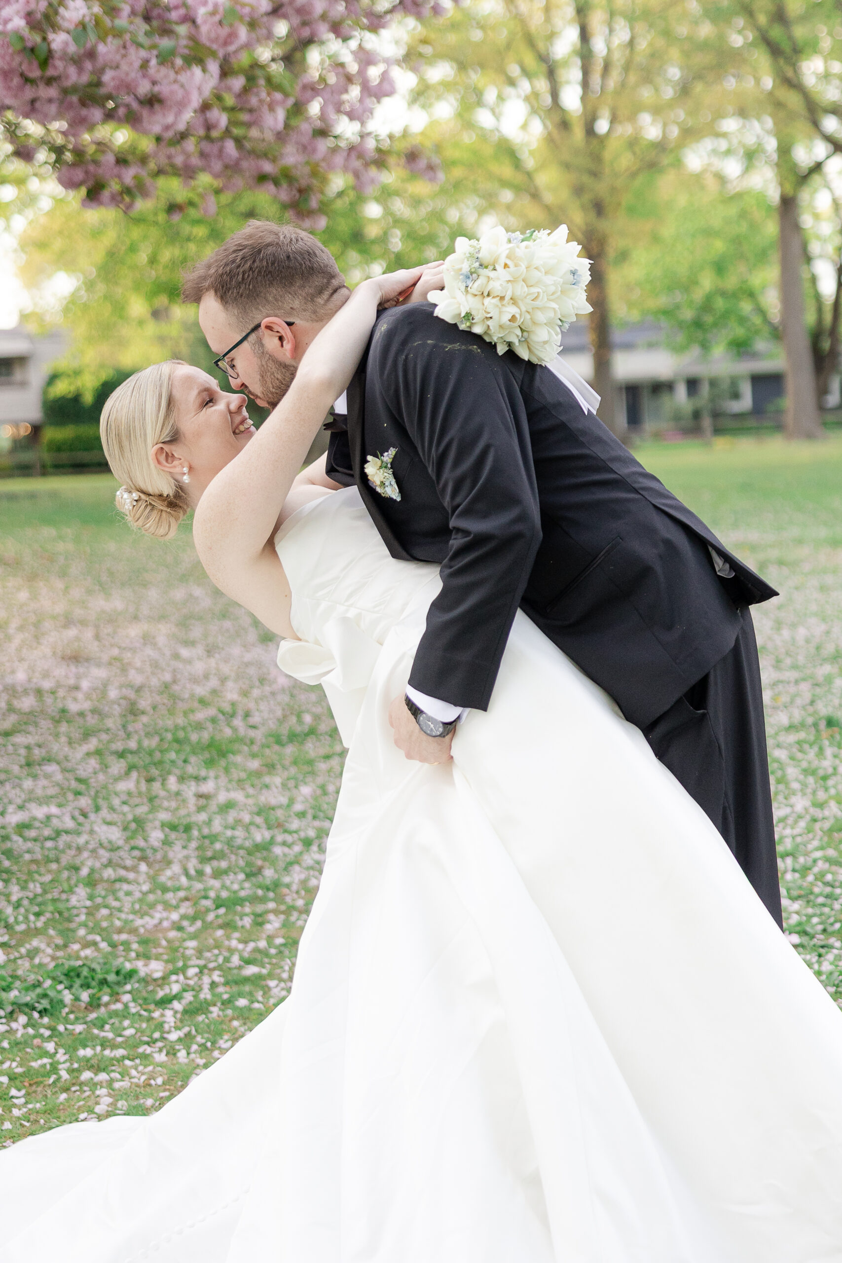 Bride and groom spring cherry blossoms wedding portraits at VIP Country Club Wedding