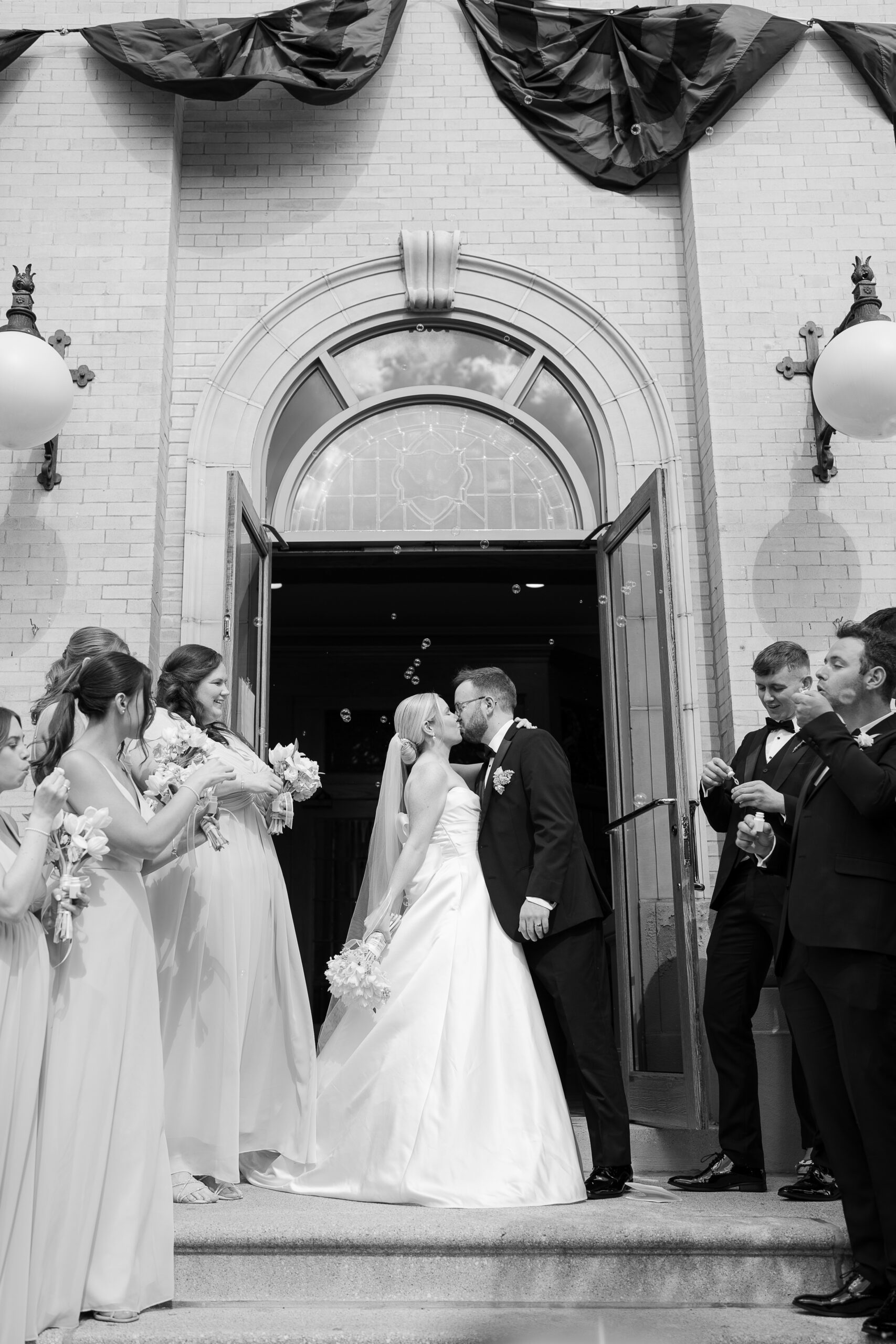 Bride and groom outside of Catholic Church 