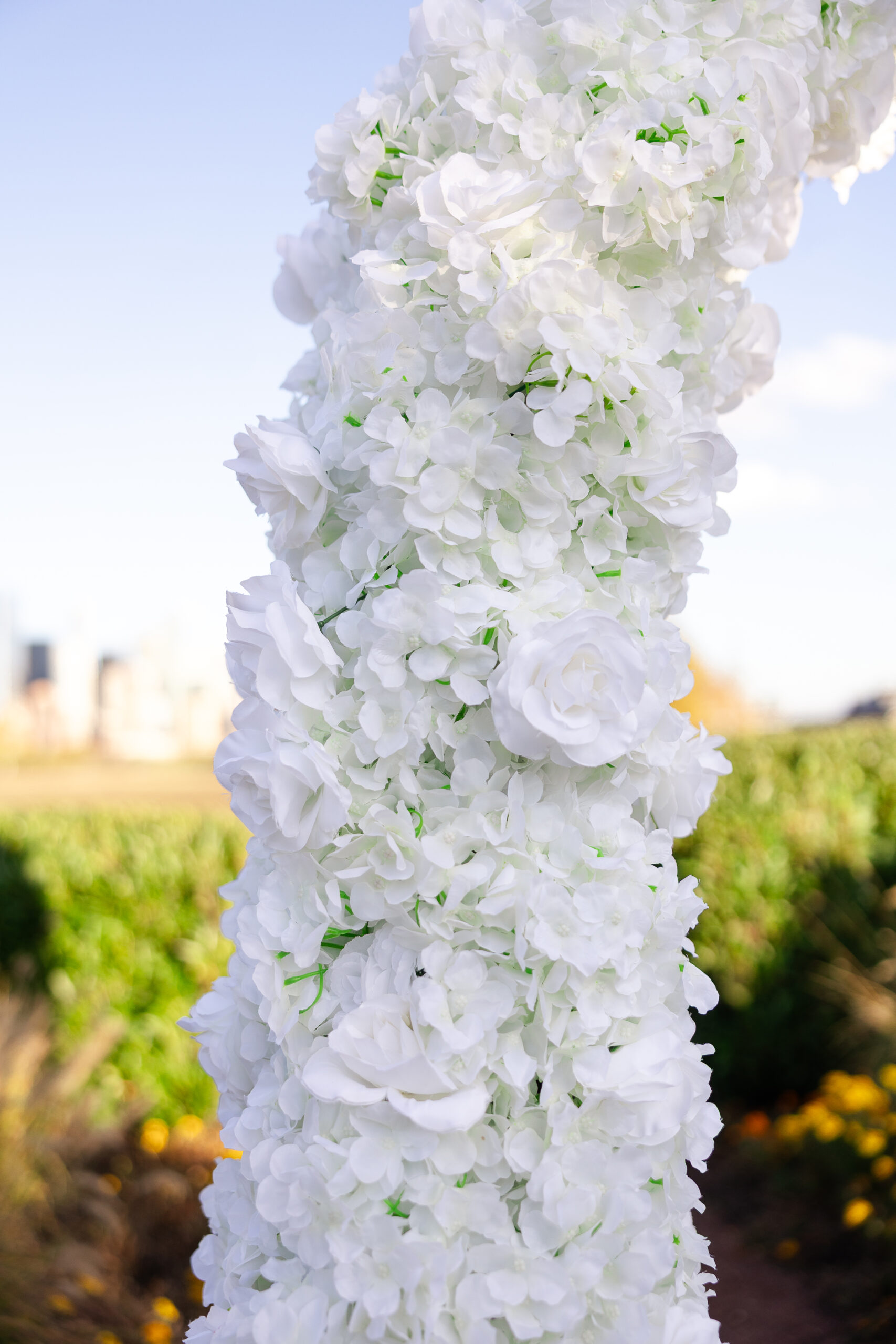 Surprise proposal at Maddy Rose Restaurant in Jersey City with white floral arch and romantic decor