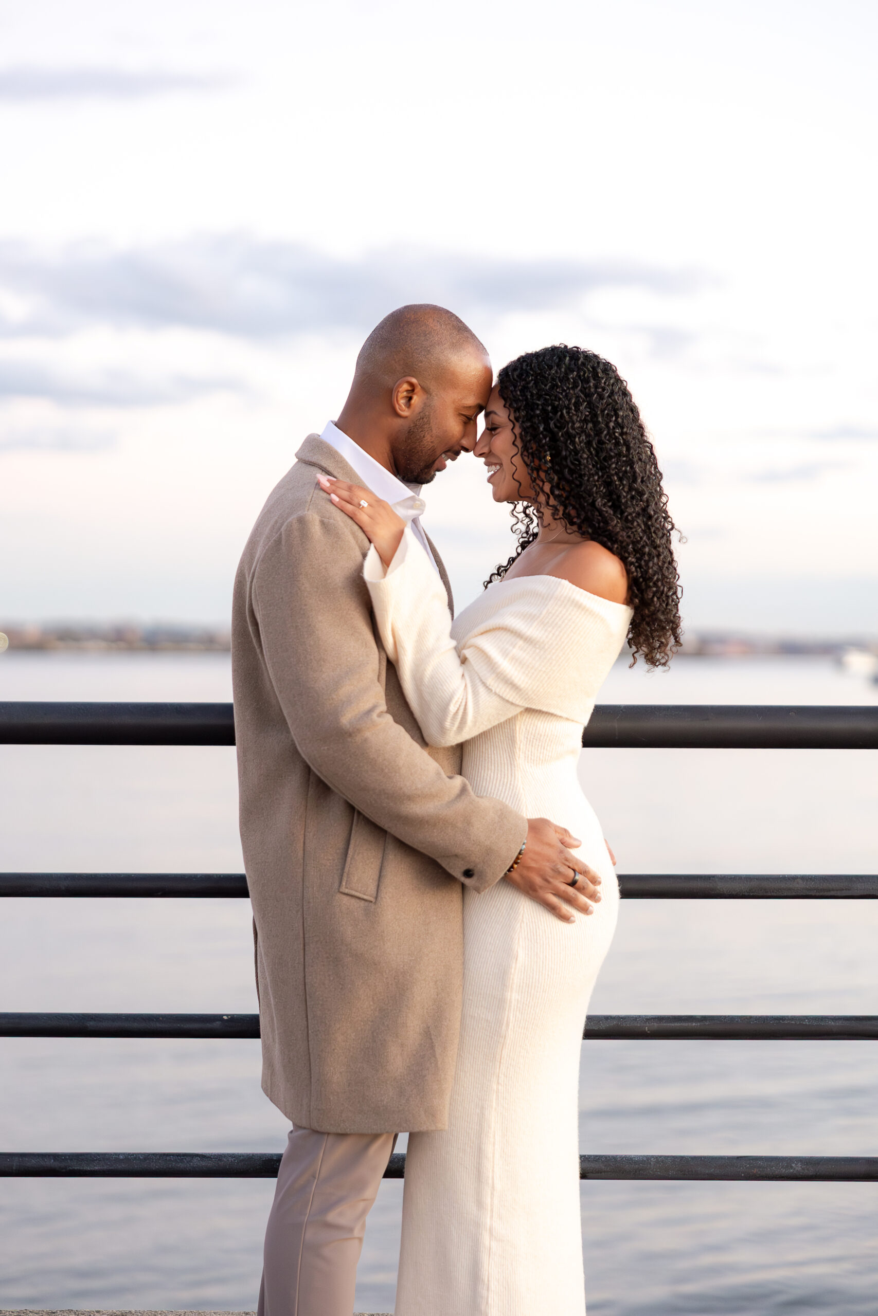 Elegant New Jersey couple with light cream dress and light beige jacket