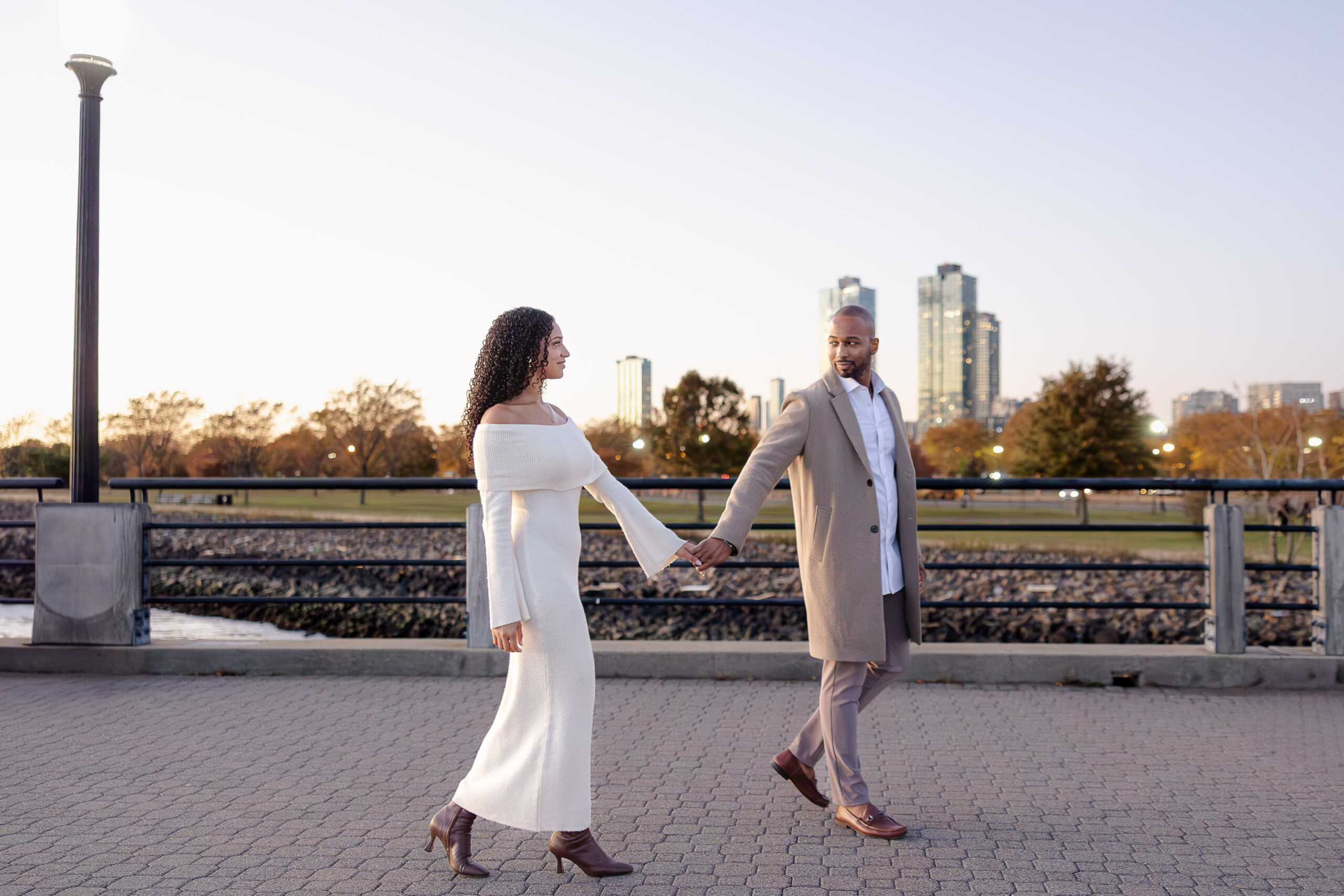 Liberty State Park engagement session with fall evening light and skyline views