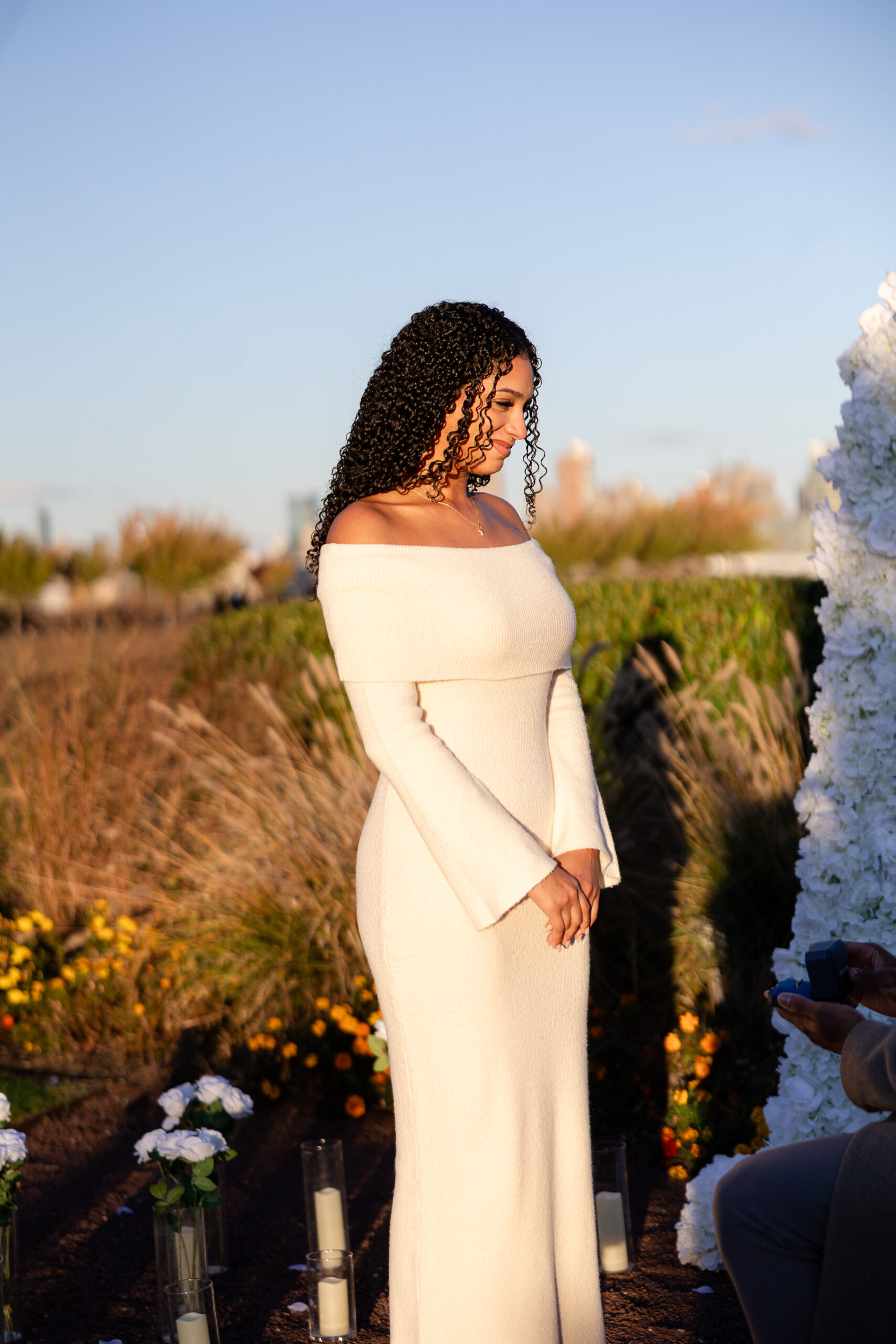 Jersey City proposal photographer capturing the moment he gets on one knee at Maddy Rose Restaurant