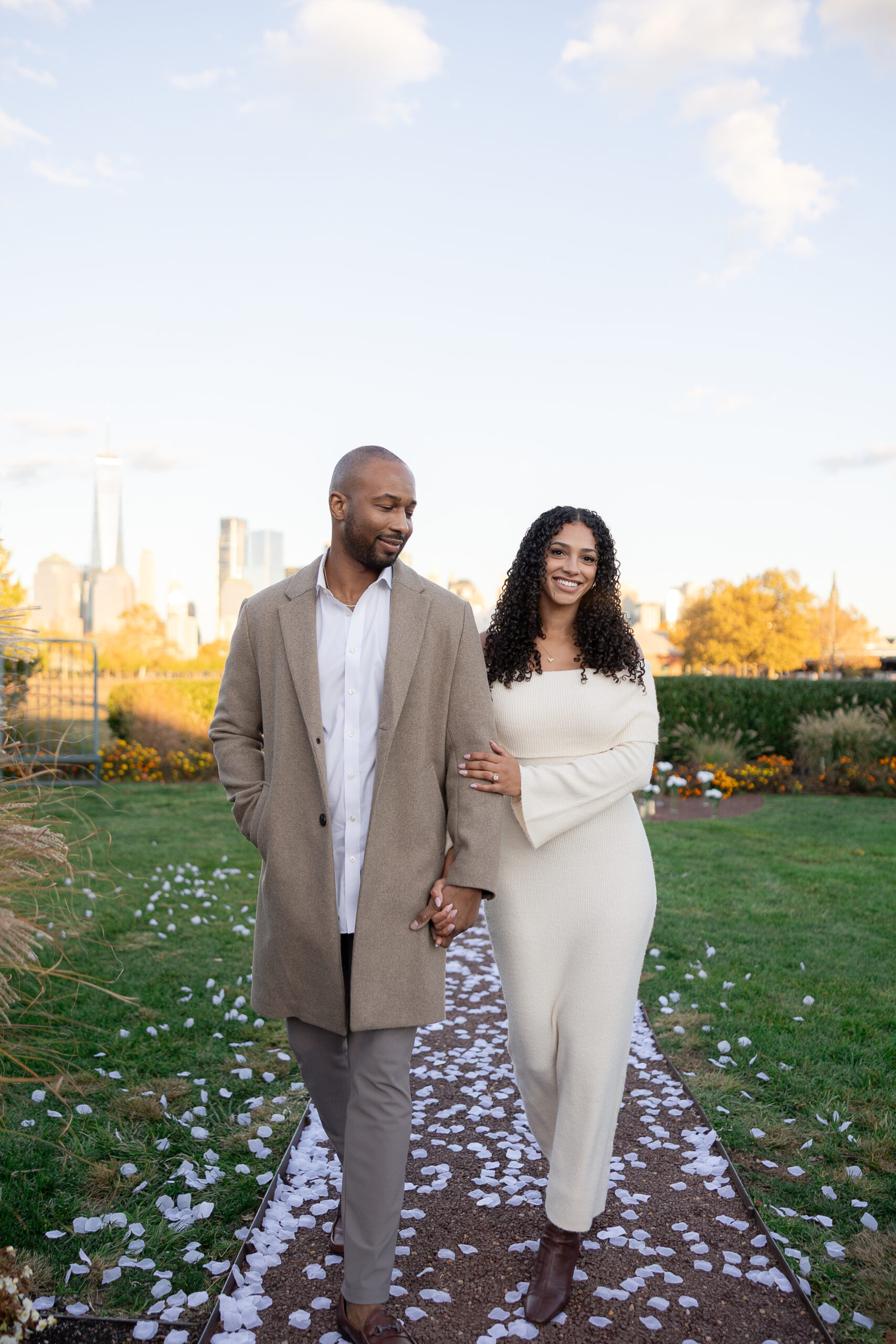 Romantic proposal setup with white floral arch by decor vendor in Jersey City