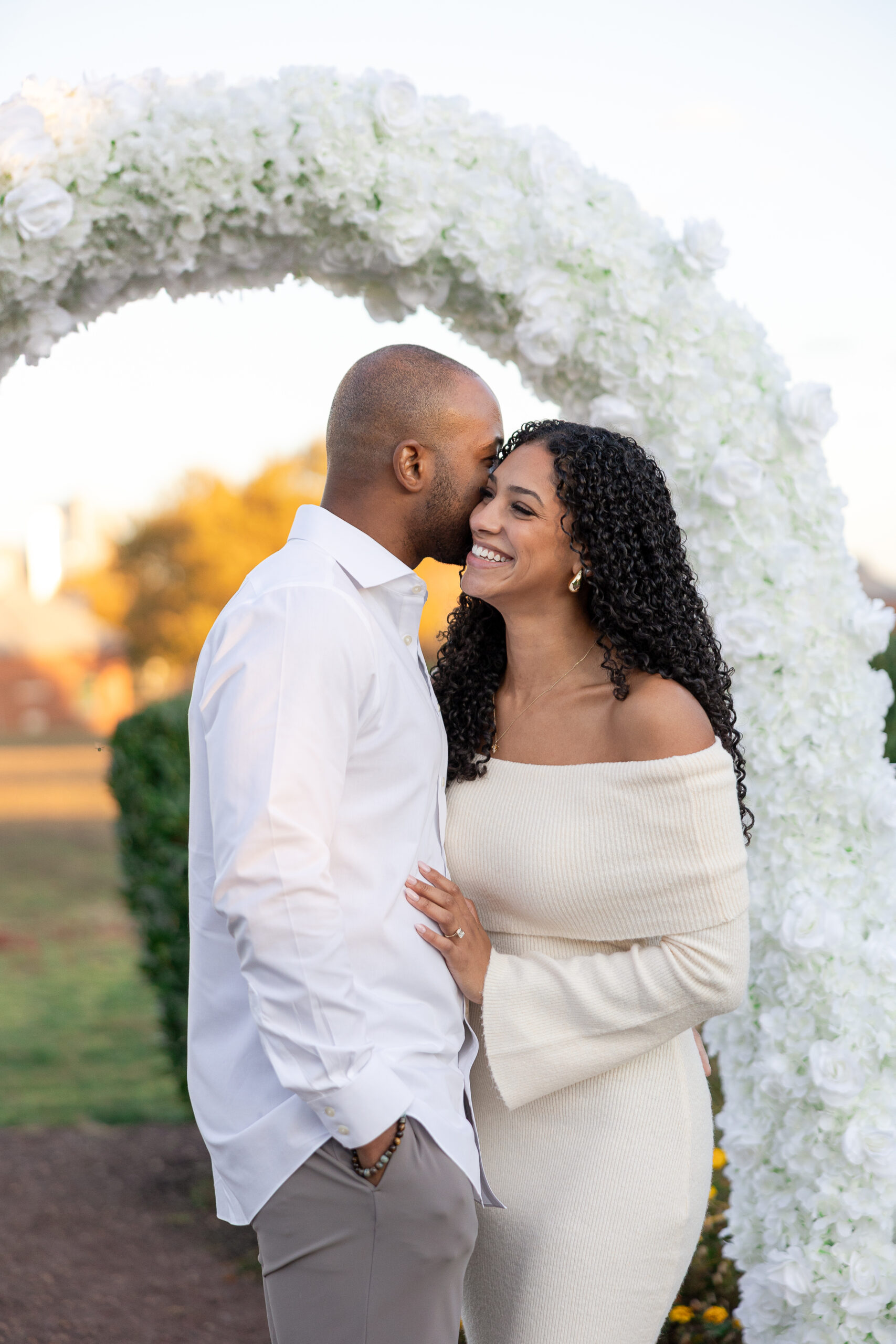 Romantic proposal setup with white floral arch by decor vendor in Jersey City