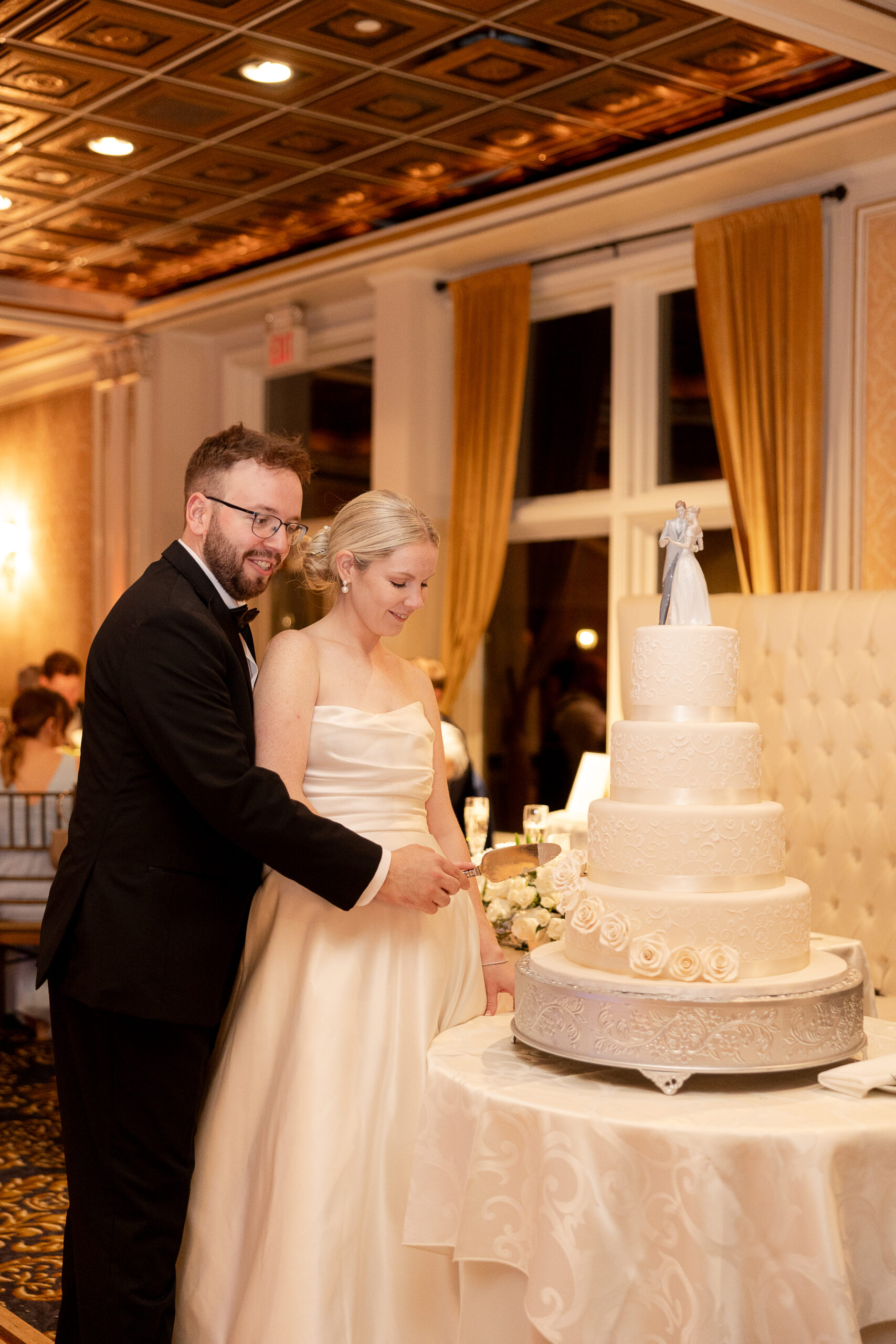 VIP Country Club wedding reception cake cutting with bride and groom