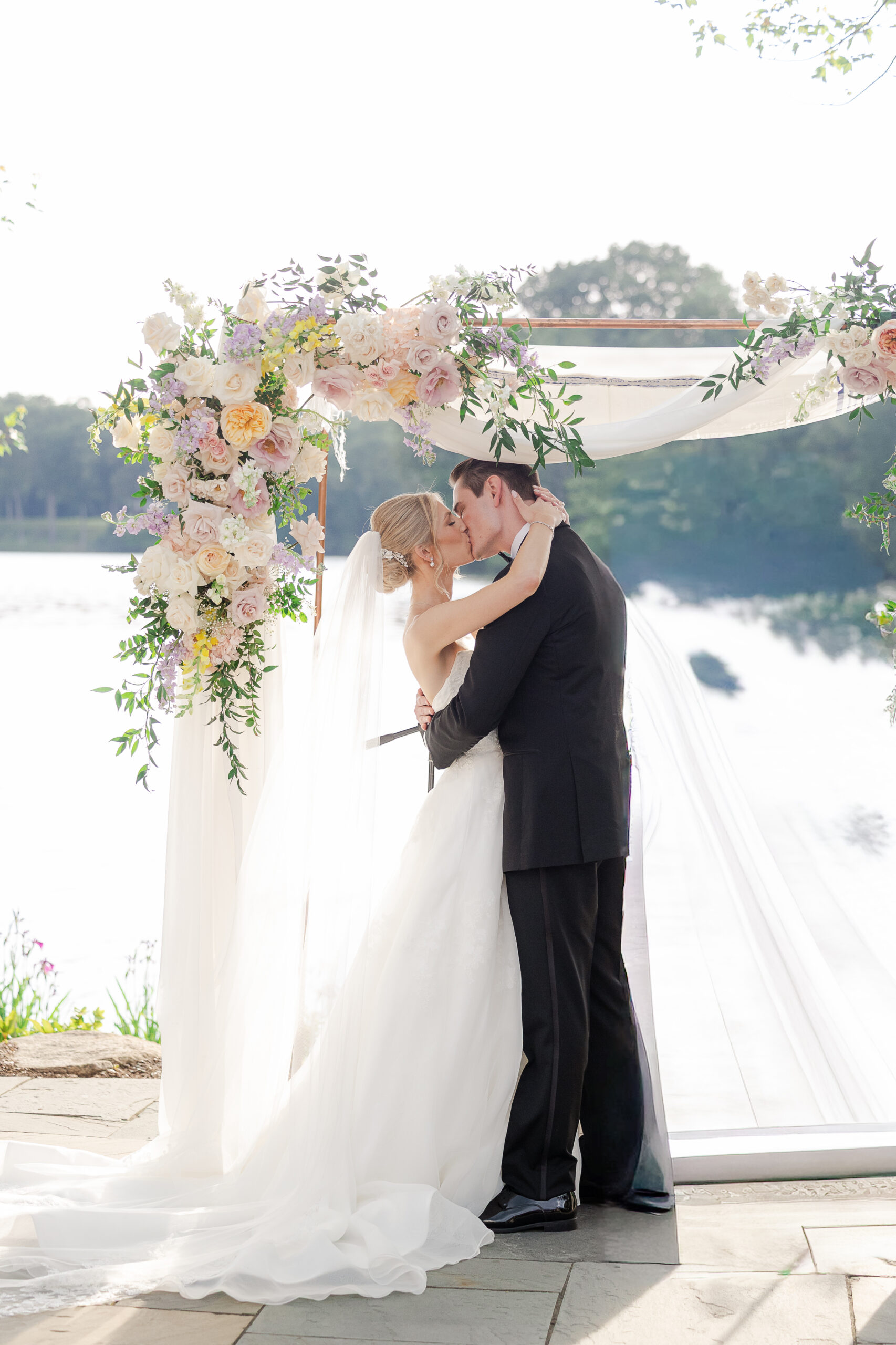 Bride and groom first kiss at NJ wedding ceremony
