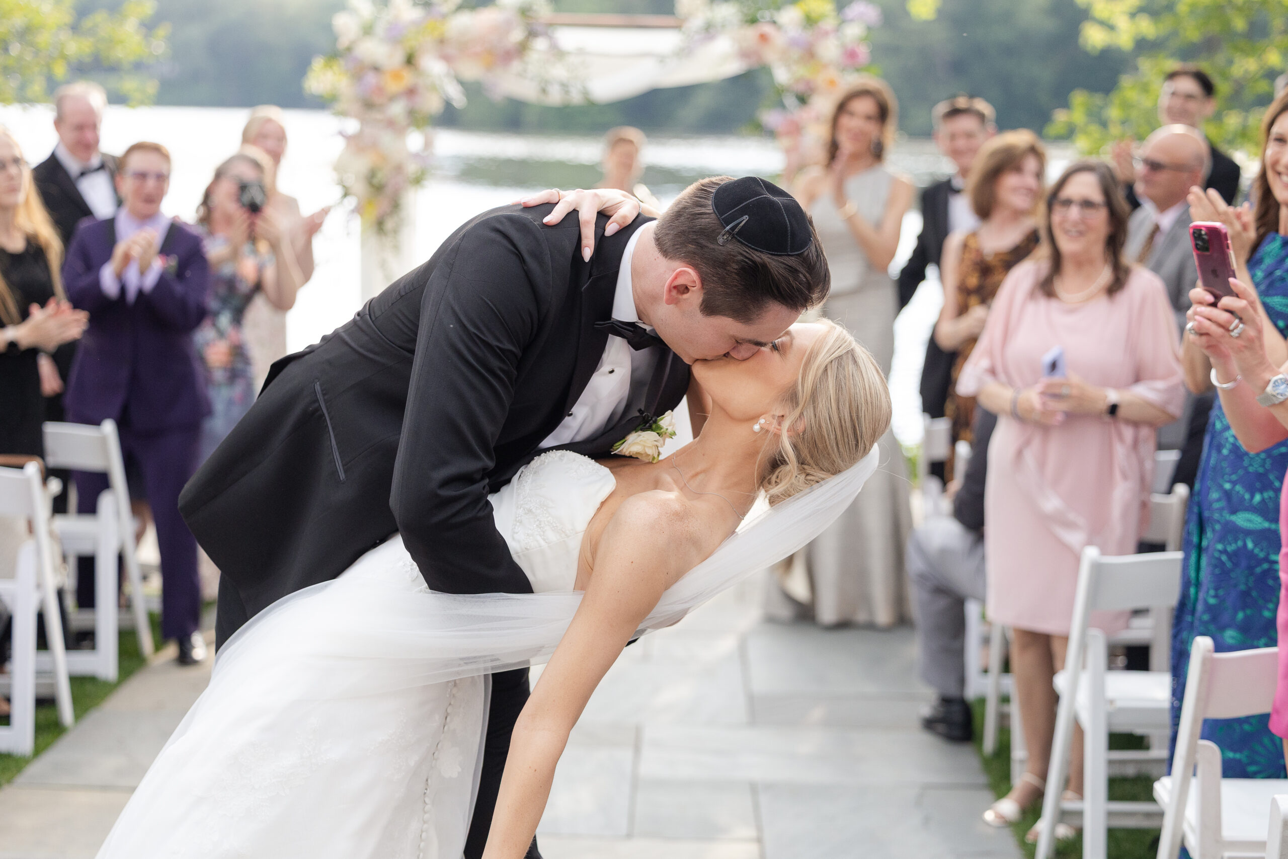 Bride and groom aisle kiss at NJ wedding ceremony
