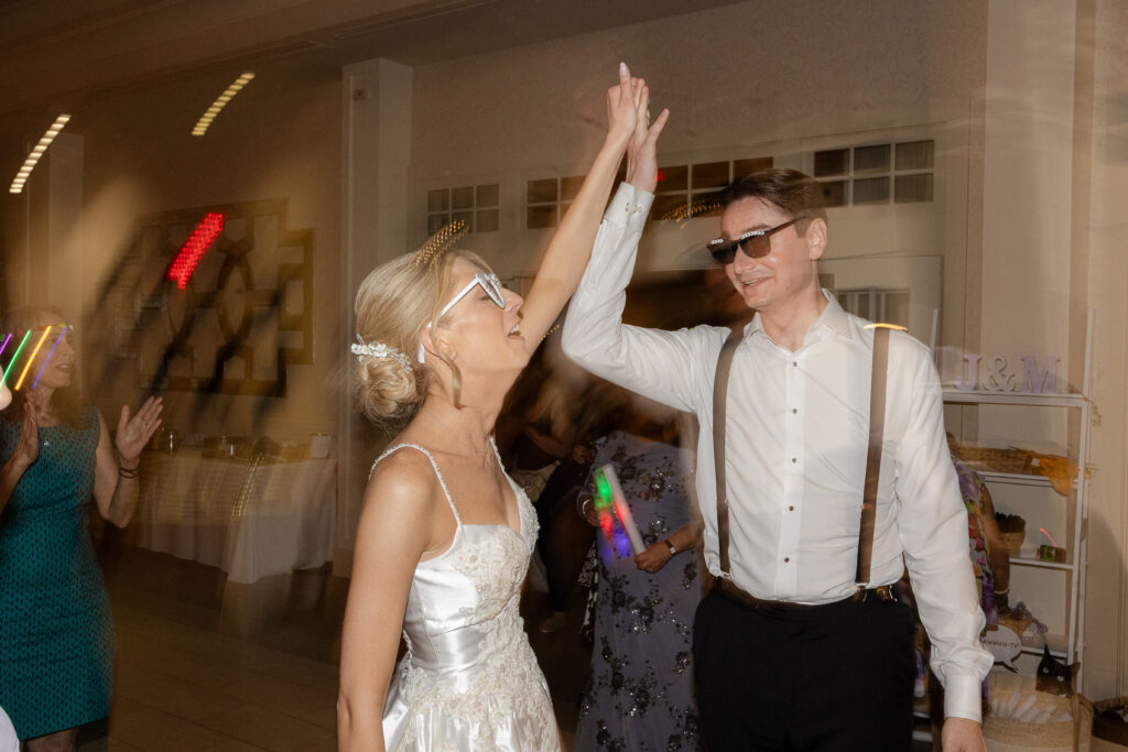 Bride and Groom DJing at wedding reception