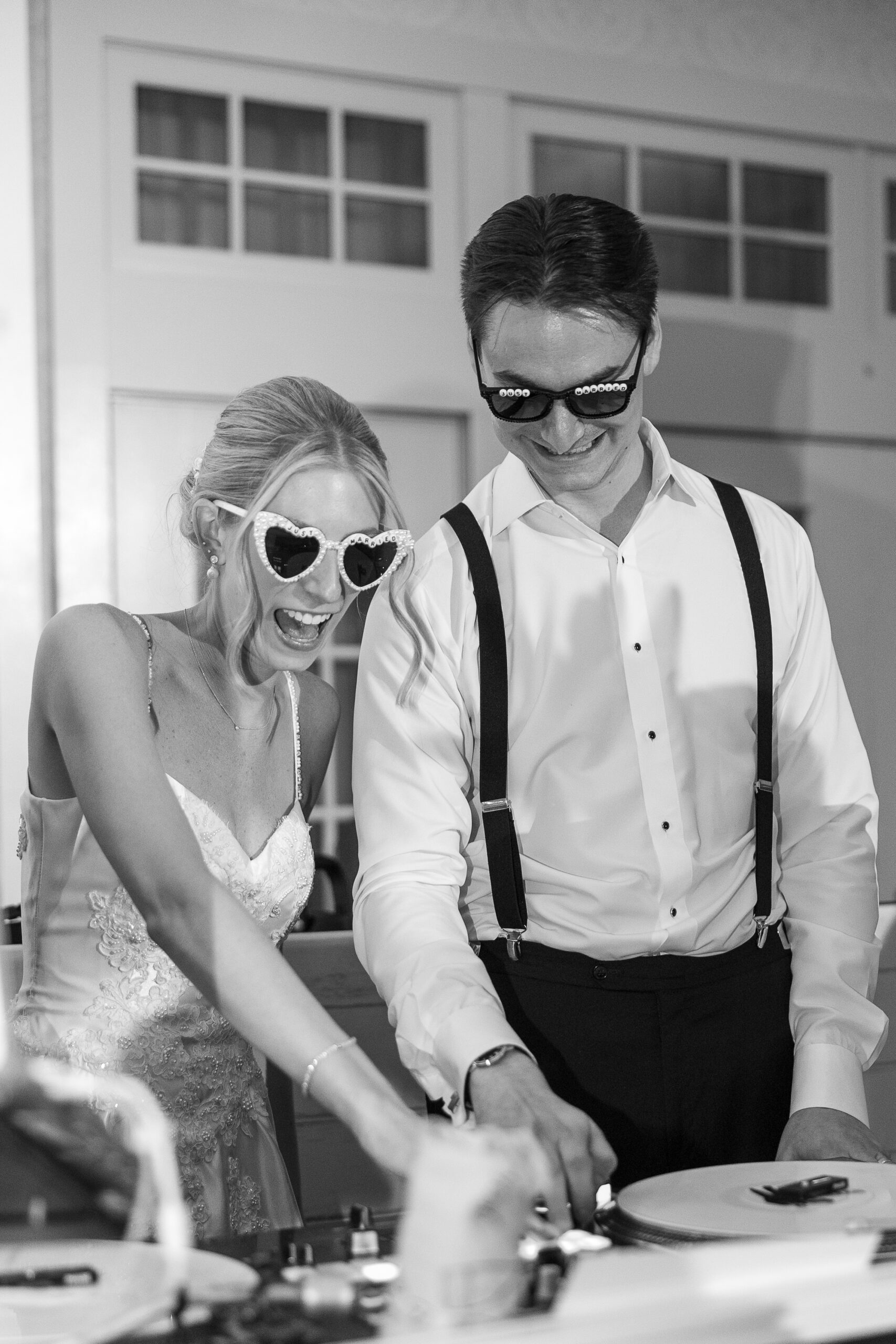 Bride and Groom DJing at wedding reception