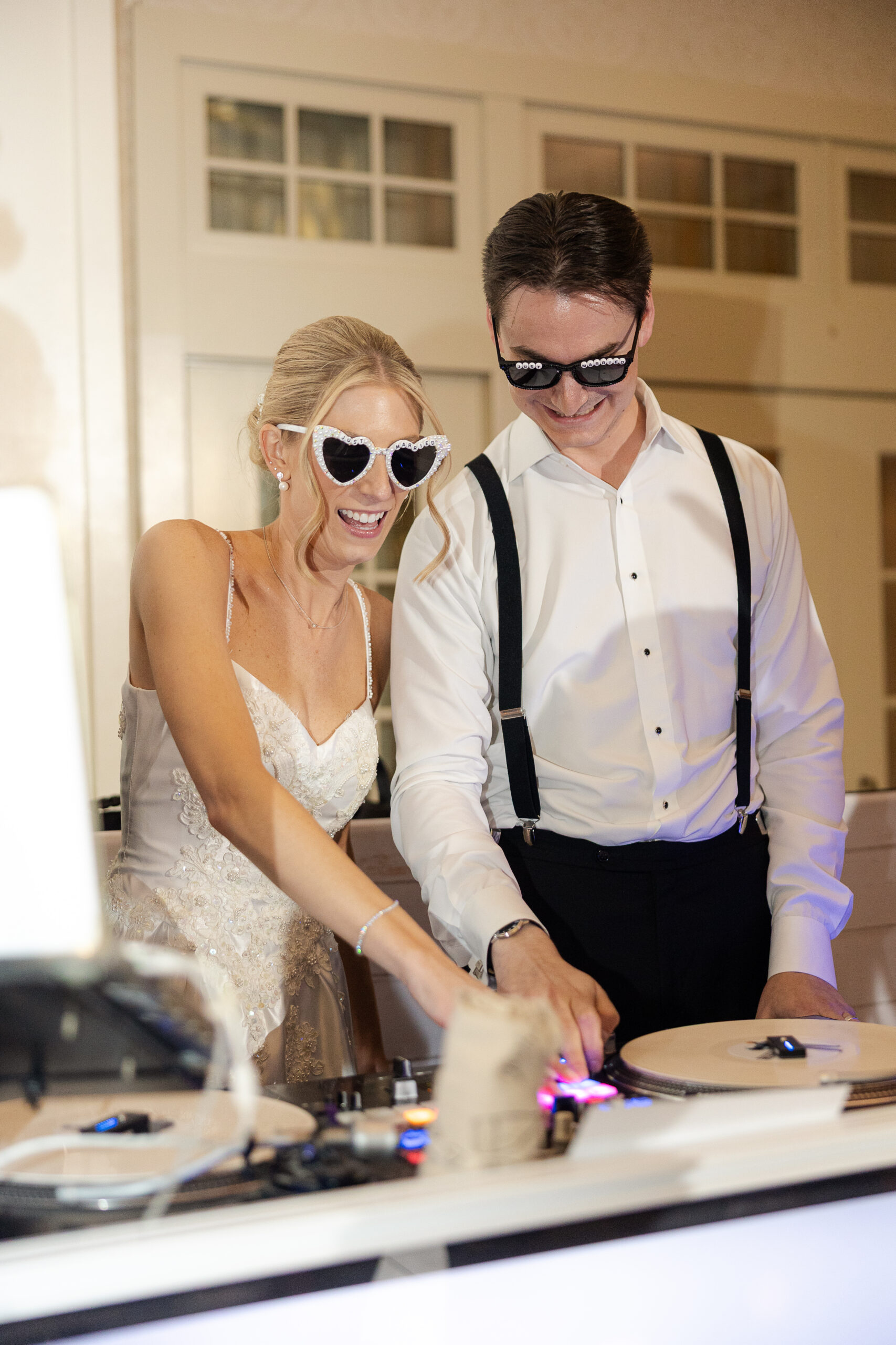 Bride and Groom DJing at wedding reception