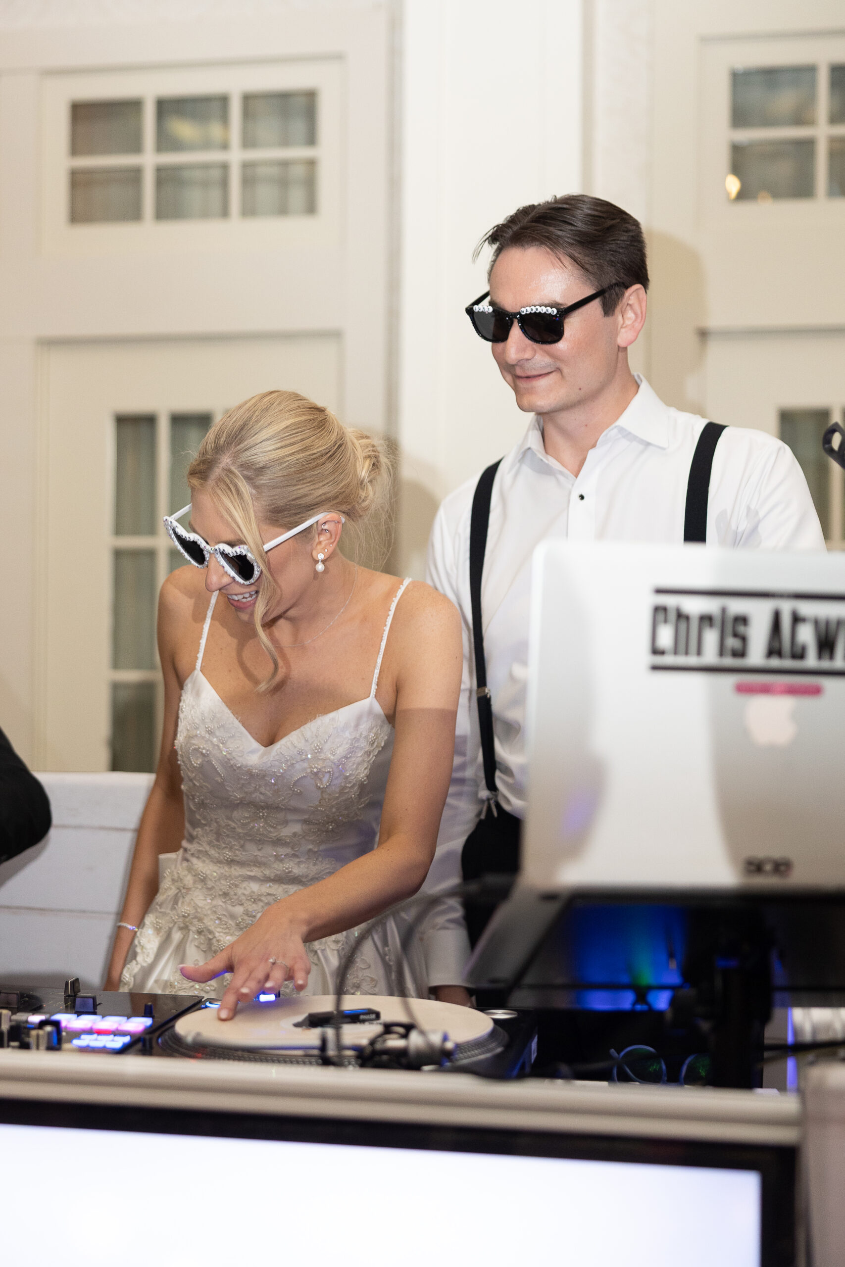 Bride and Groom DJing at wedding reception