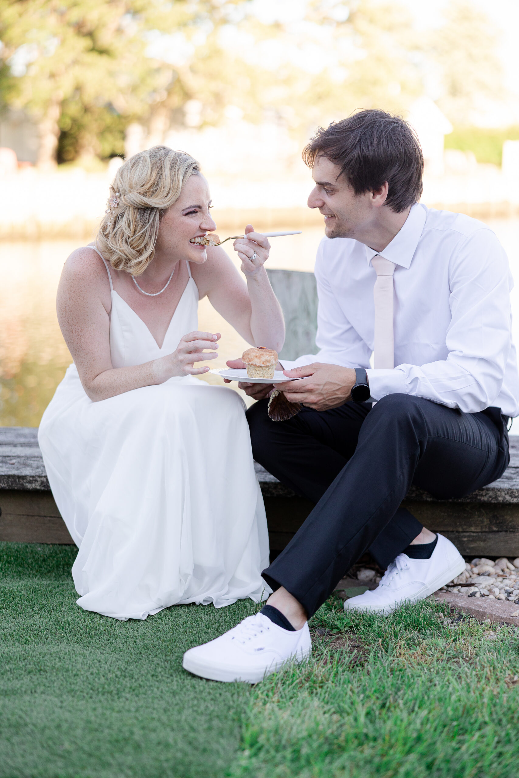 Casual cupcake cutting with bride and groom