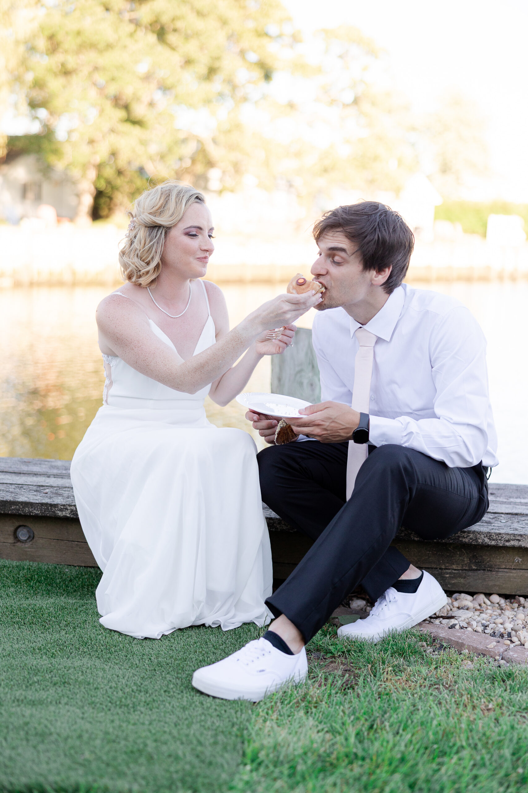 Casual cupcake cutting with bride and groom