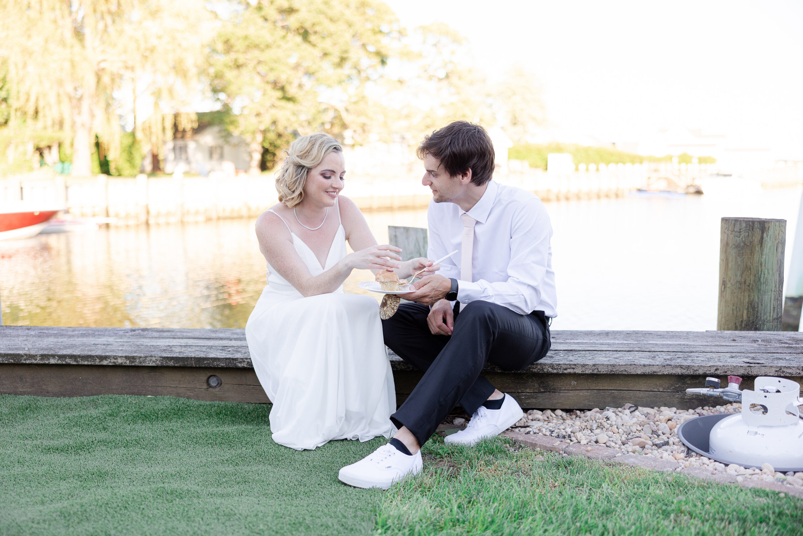 Casual cupcake cutting with bride and groom