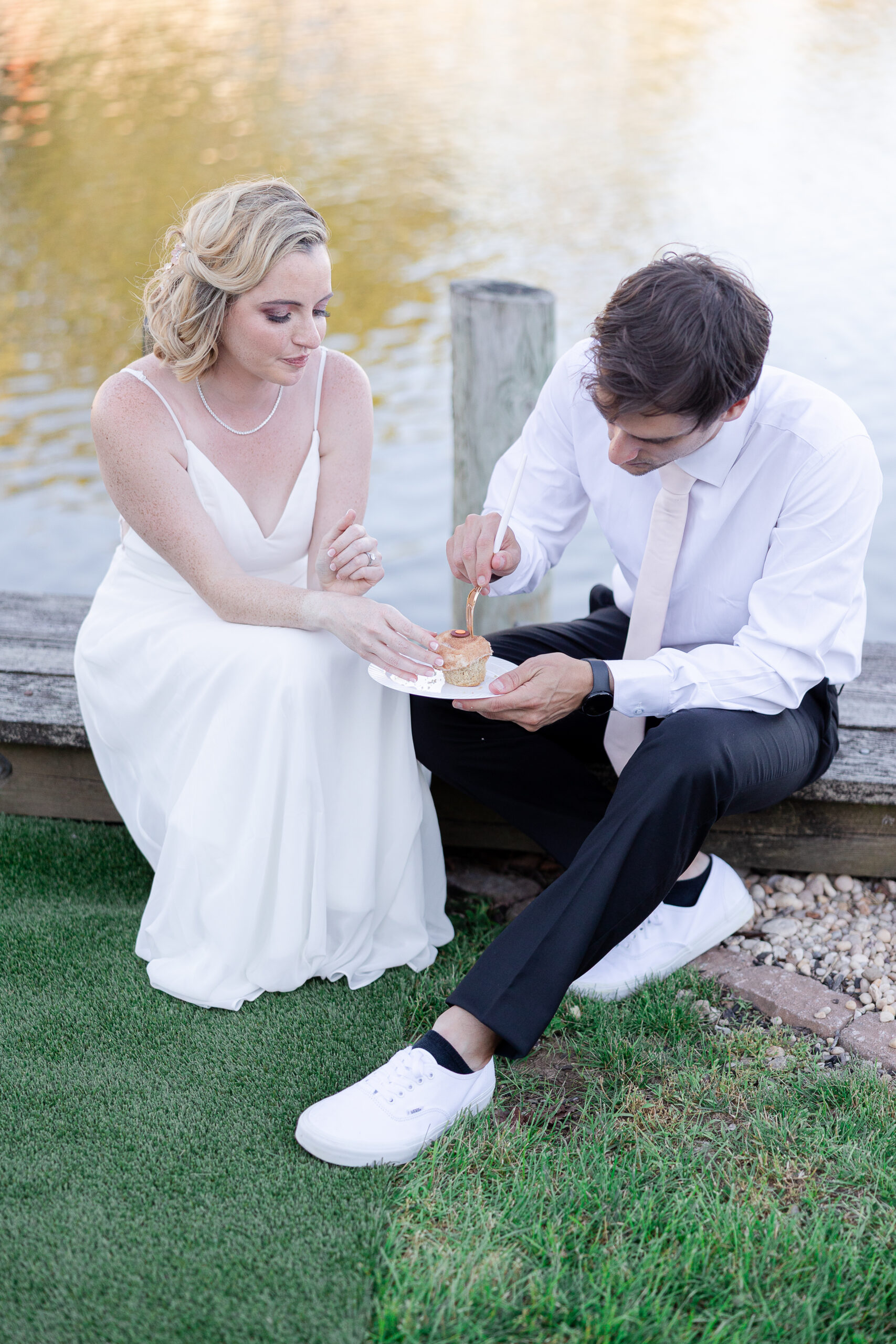 Casual cupcake cutting with bride and groom