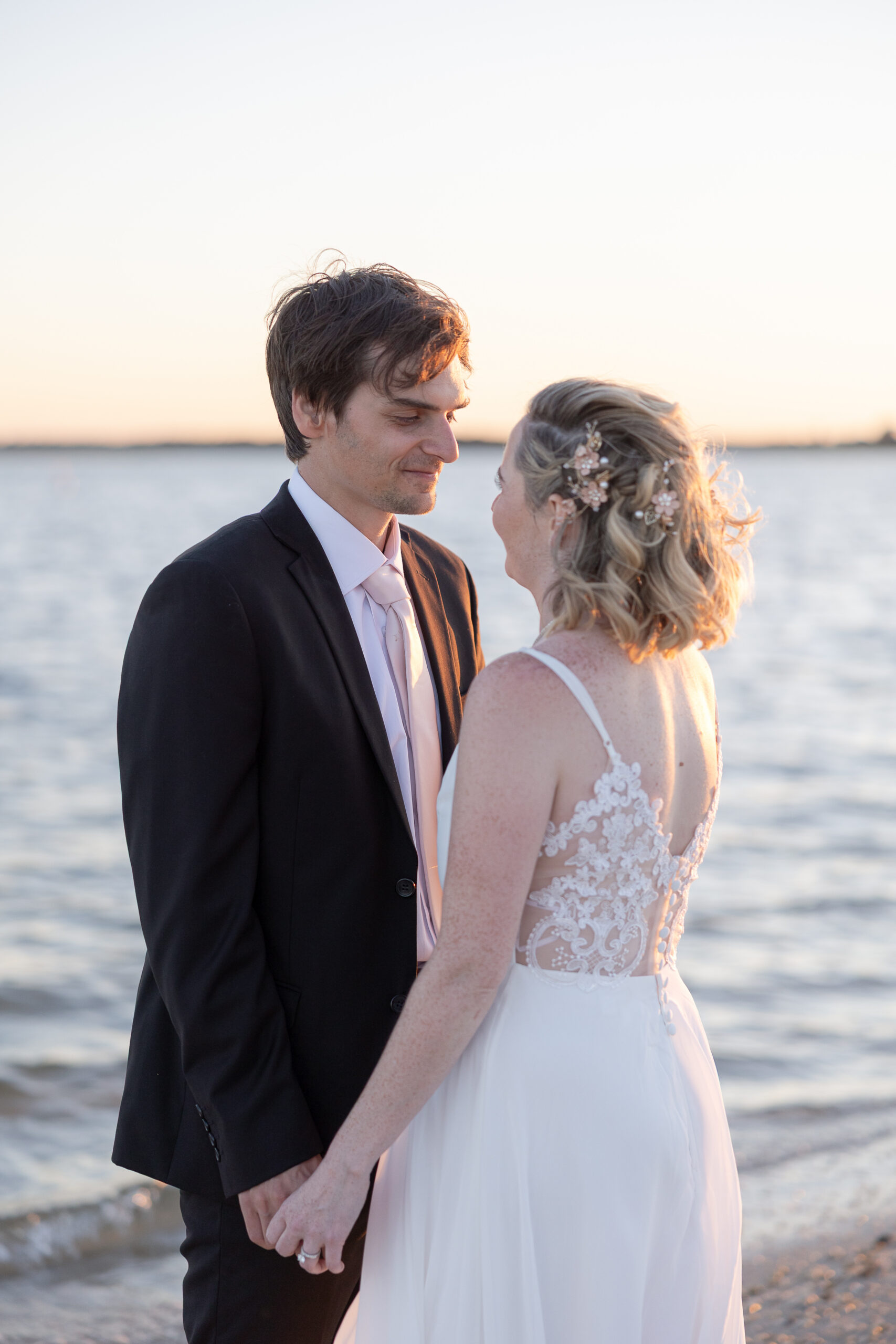 Bride and groom outdoor sunset wedding portraits 