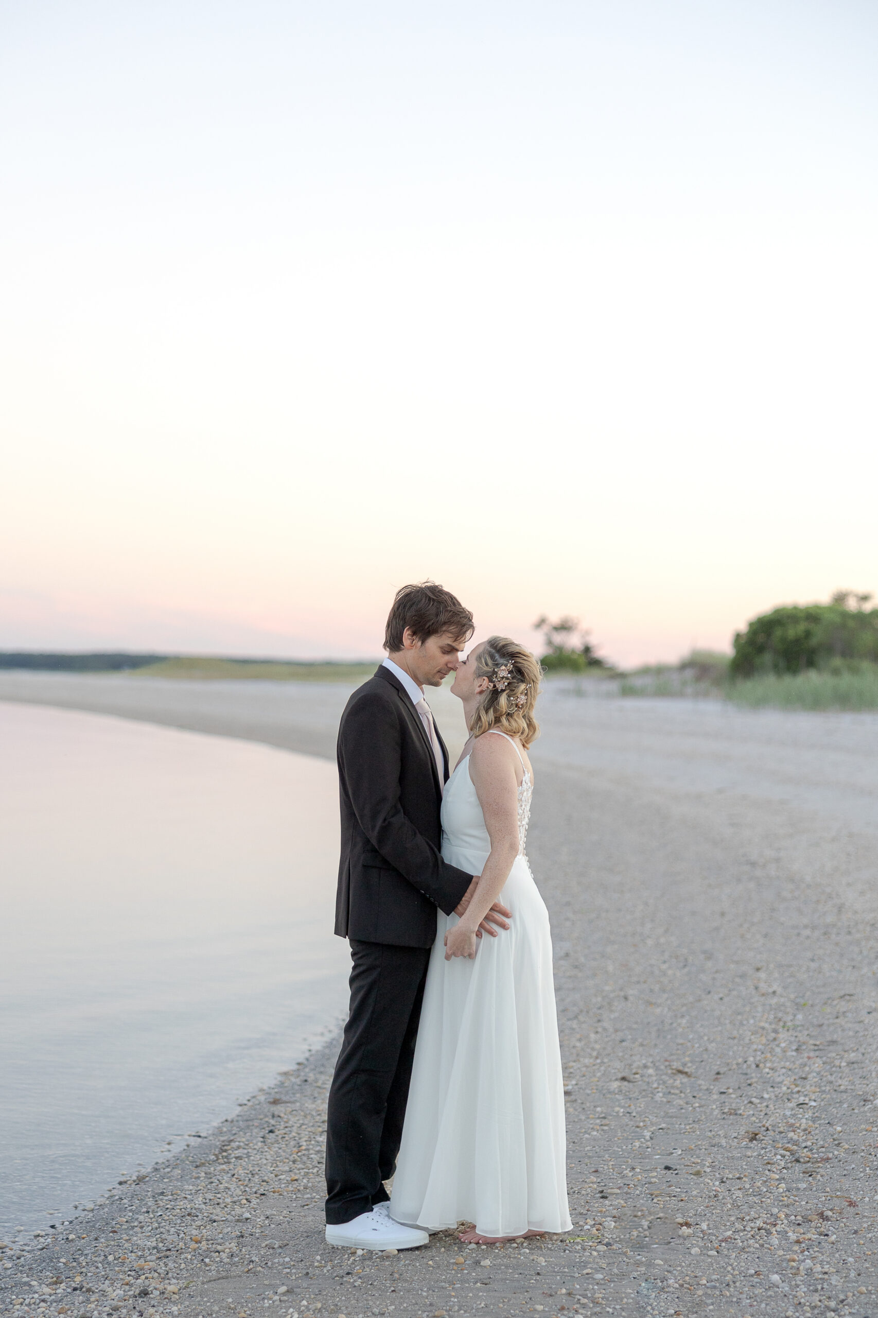 Bride and groom outdoor sunset wedding portraits 