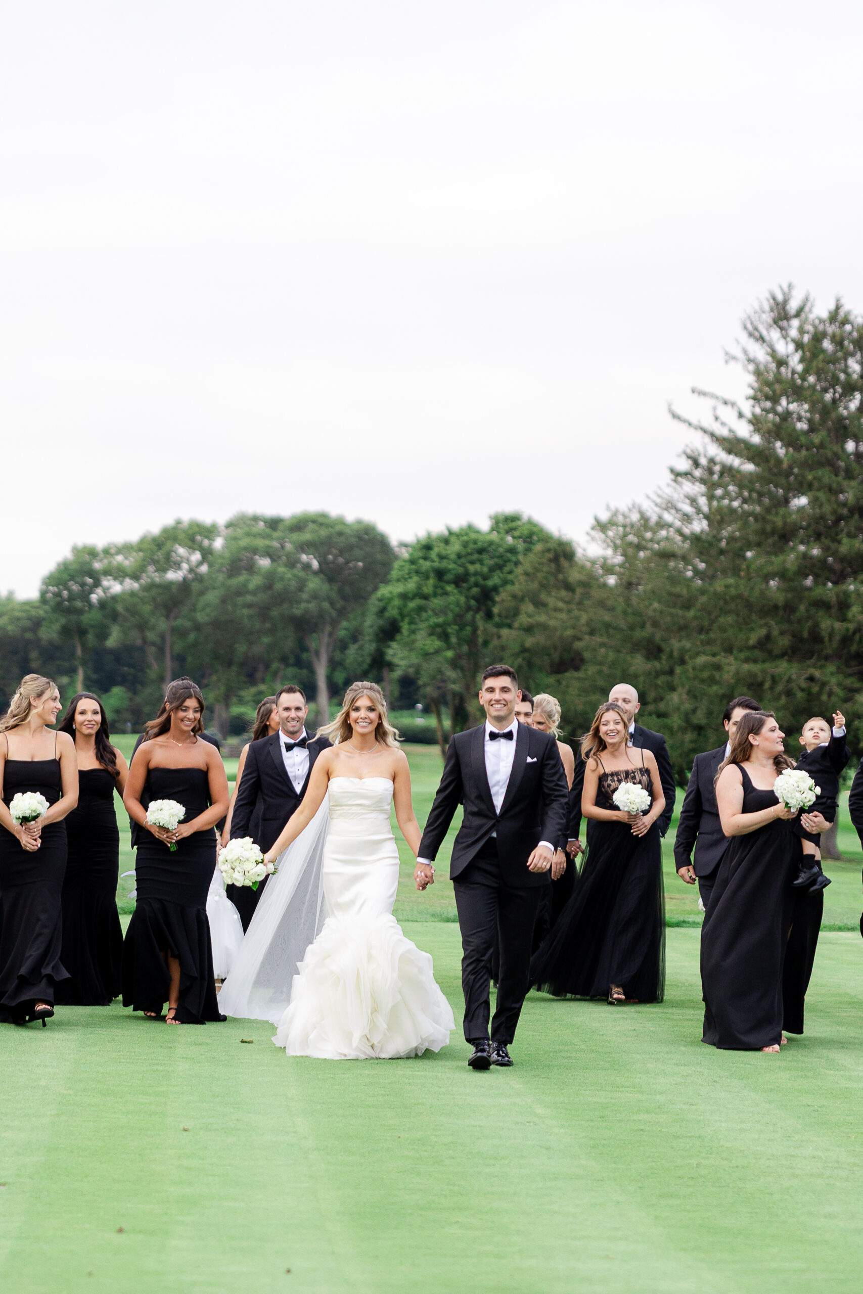 Bride and groom with wedding party at Brookville Country Club