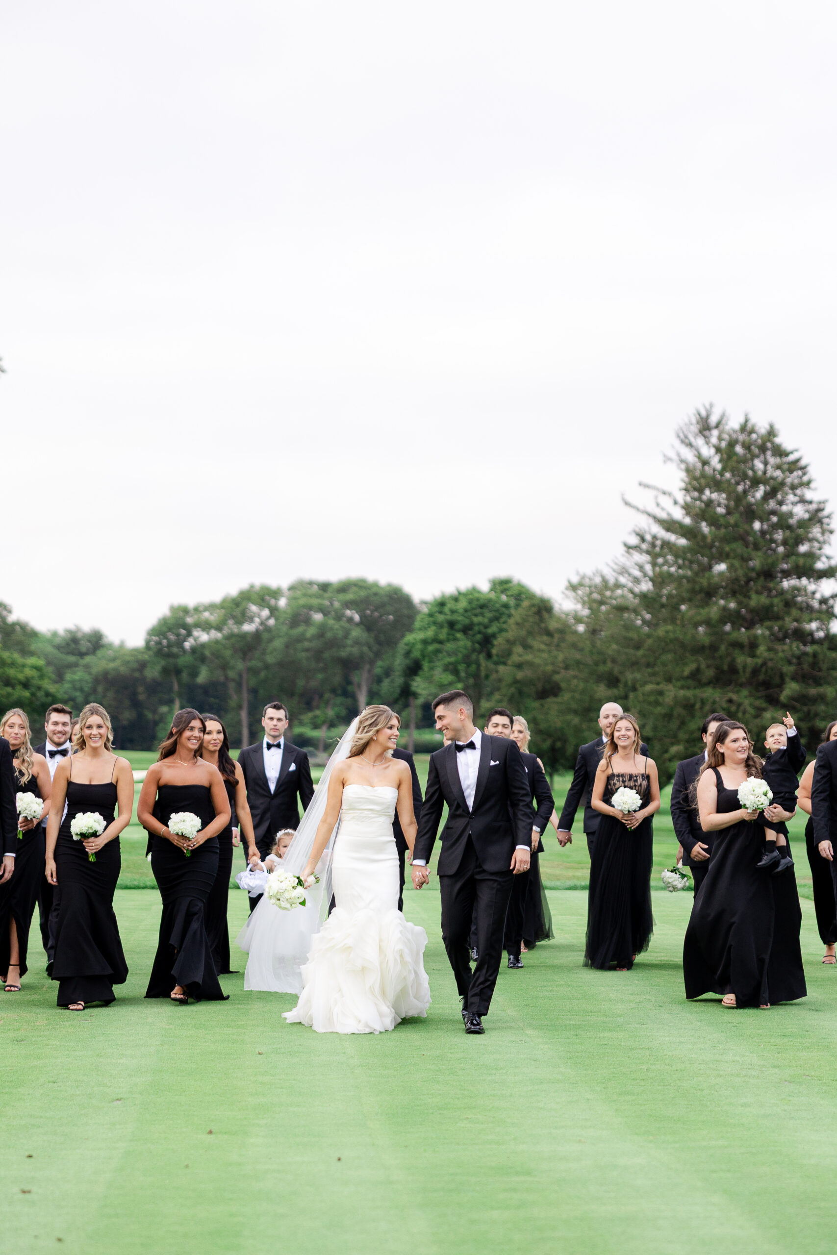 Bride and groom with wedding party at Brookville Country Club