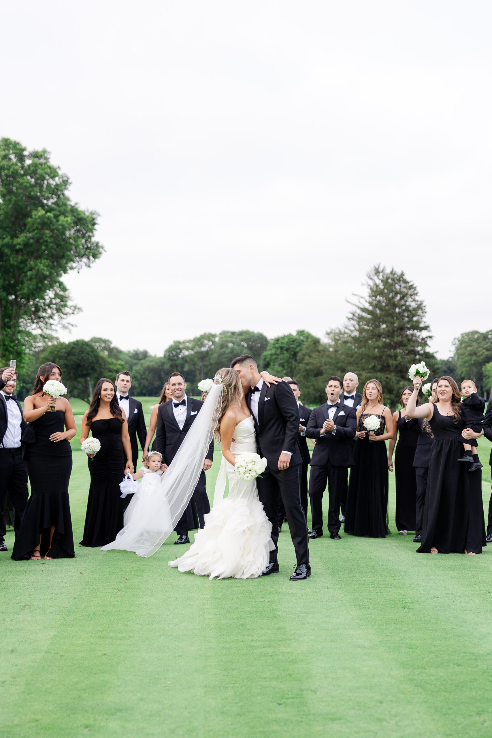 Bride and groom with wedding party at Brookville Country Club