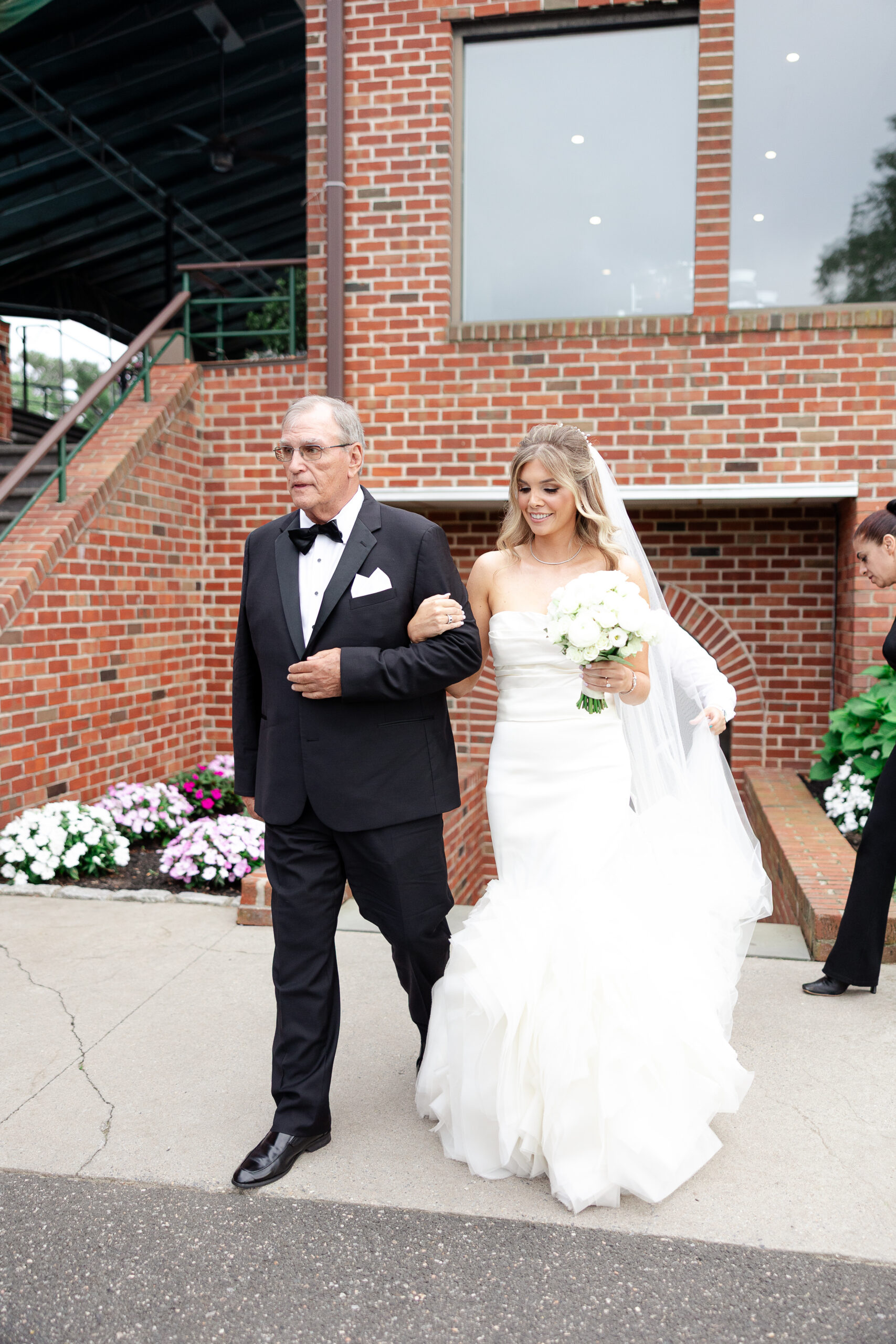 Bride walking down the aisle at Brookville country club 