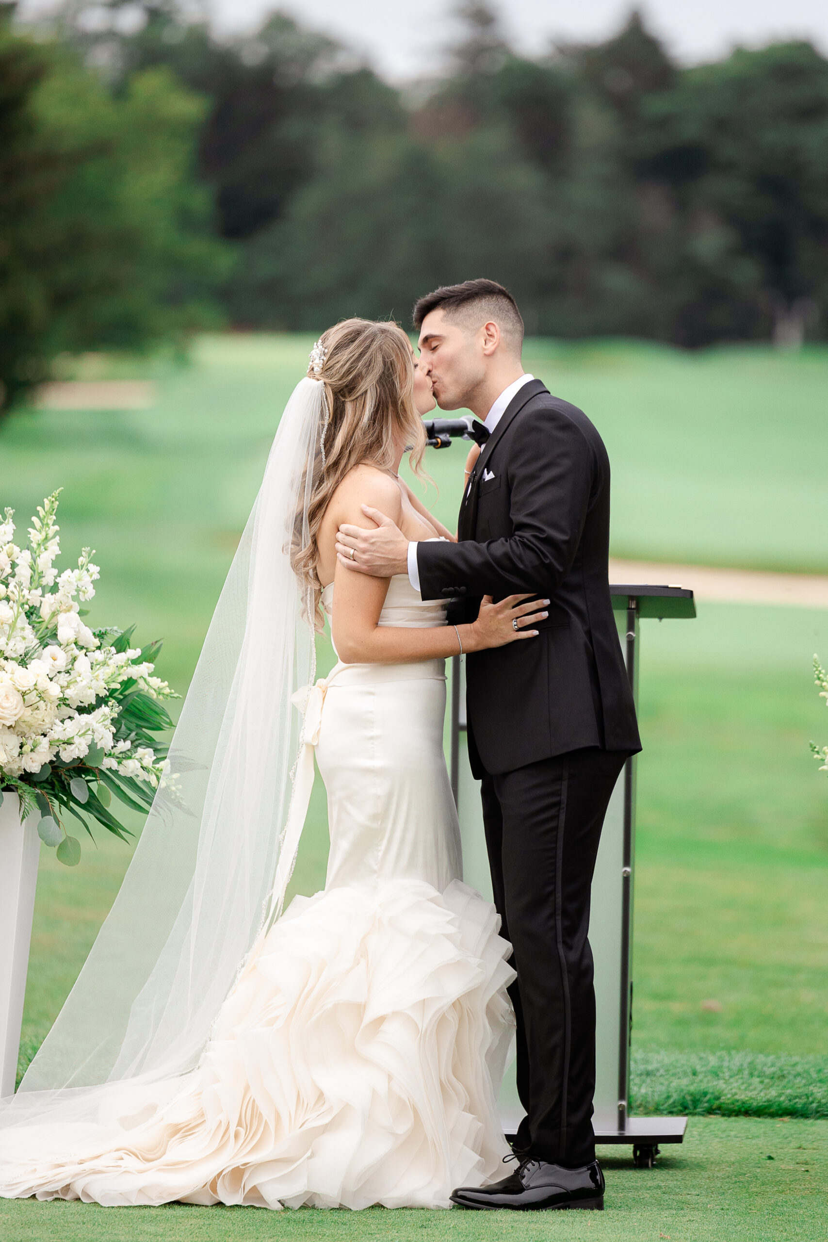 Bride and groom at outdoor country club wedding ceremony