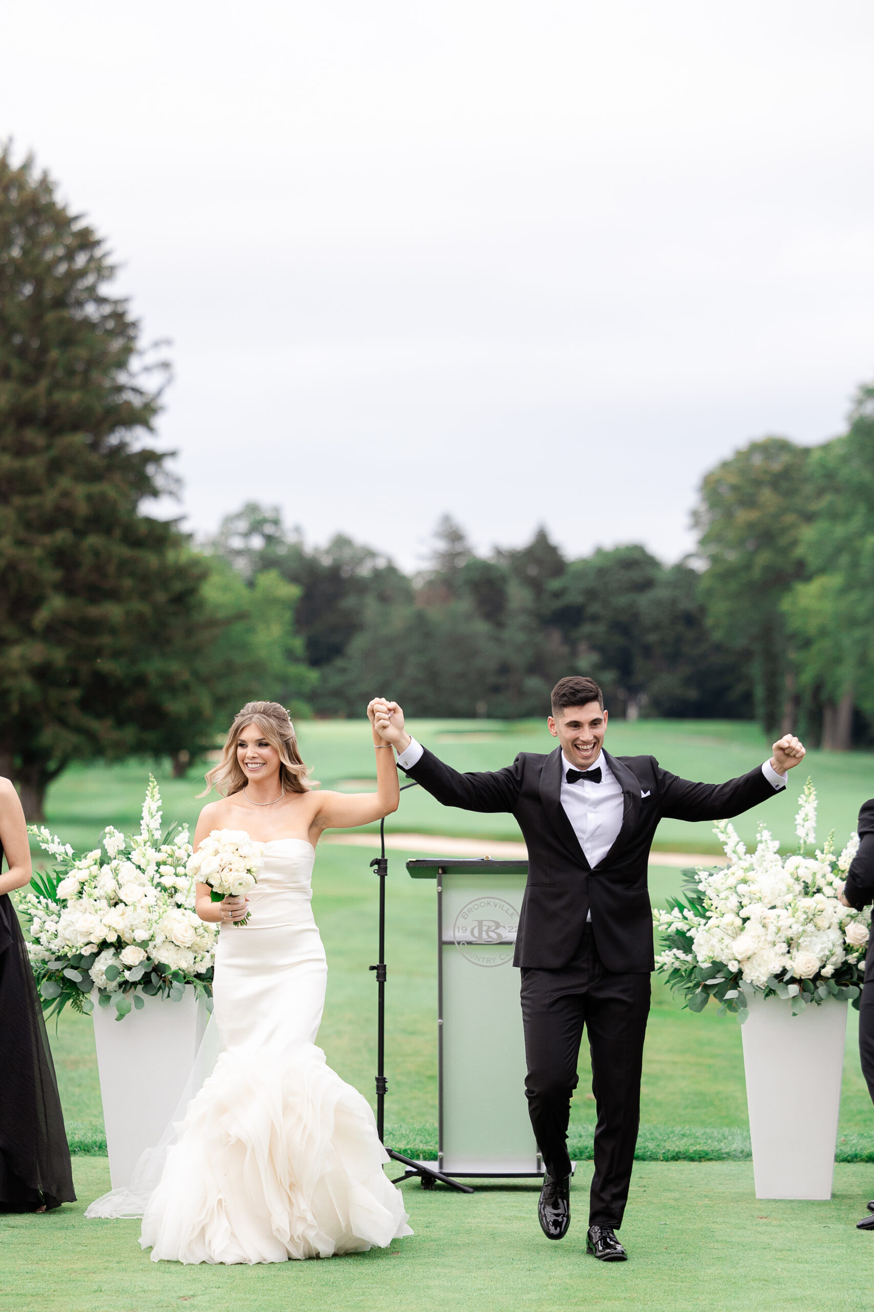 Bride and groom at outdoor country club wedding ceremony