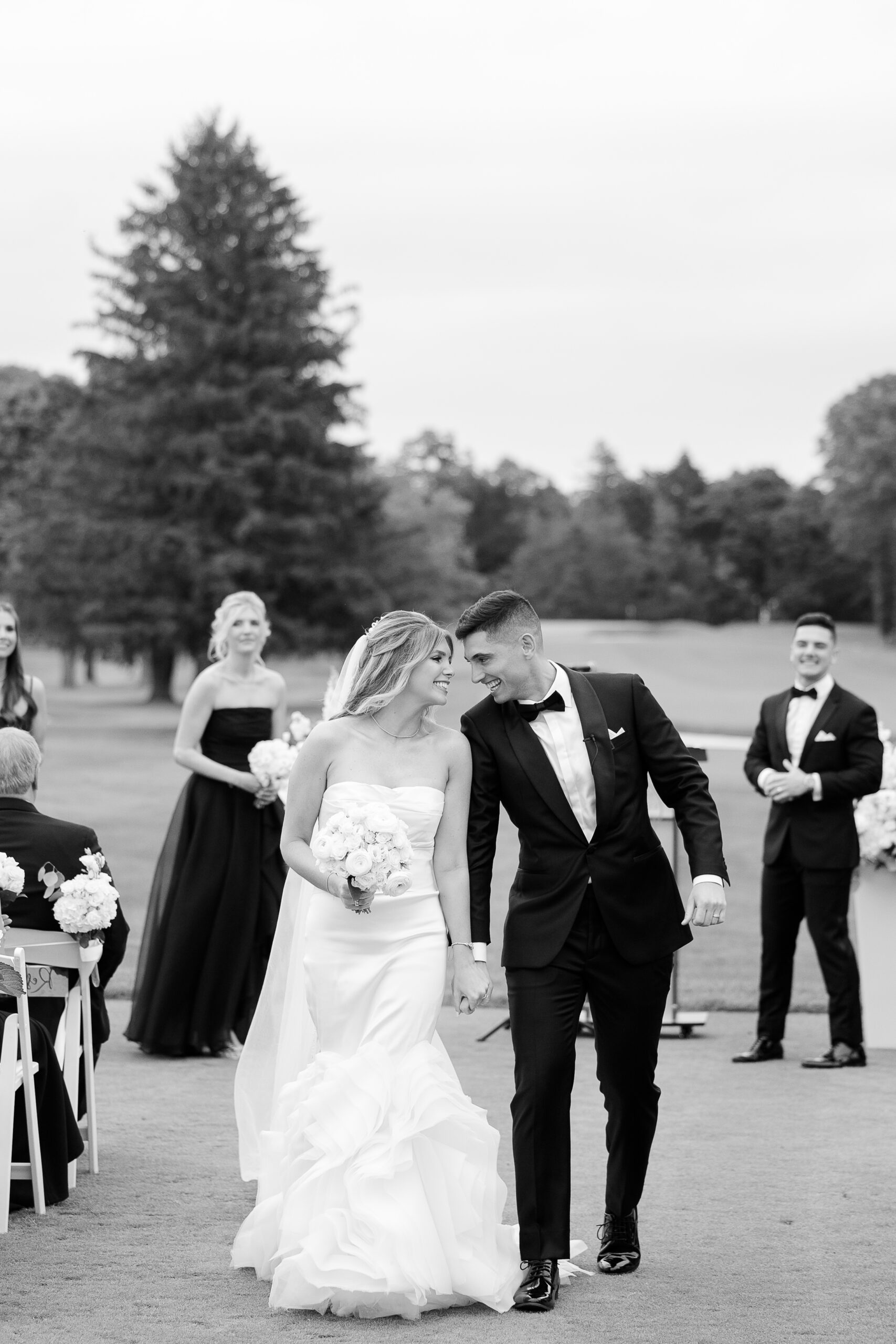 Bride and groom at outdoor country club wedding ceremony