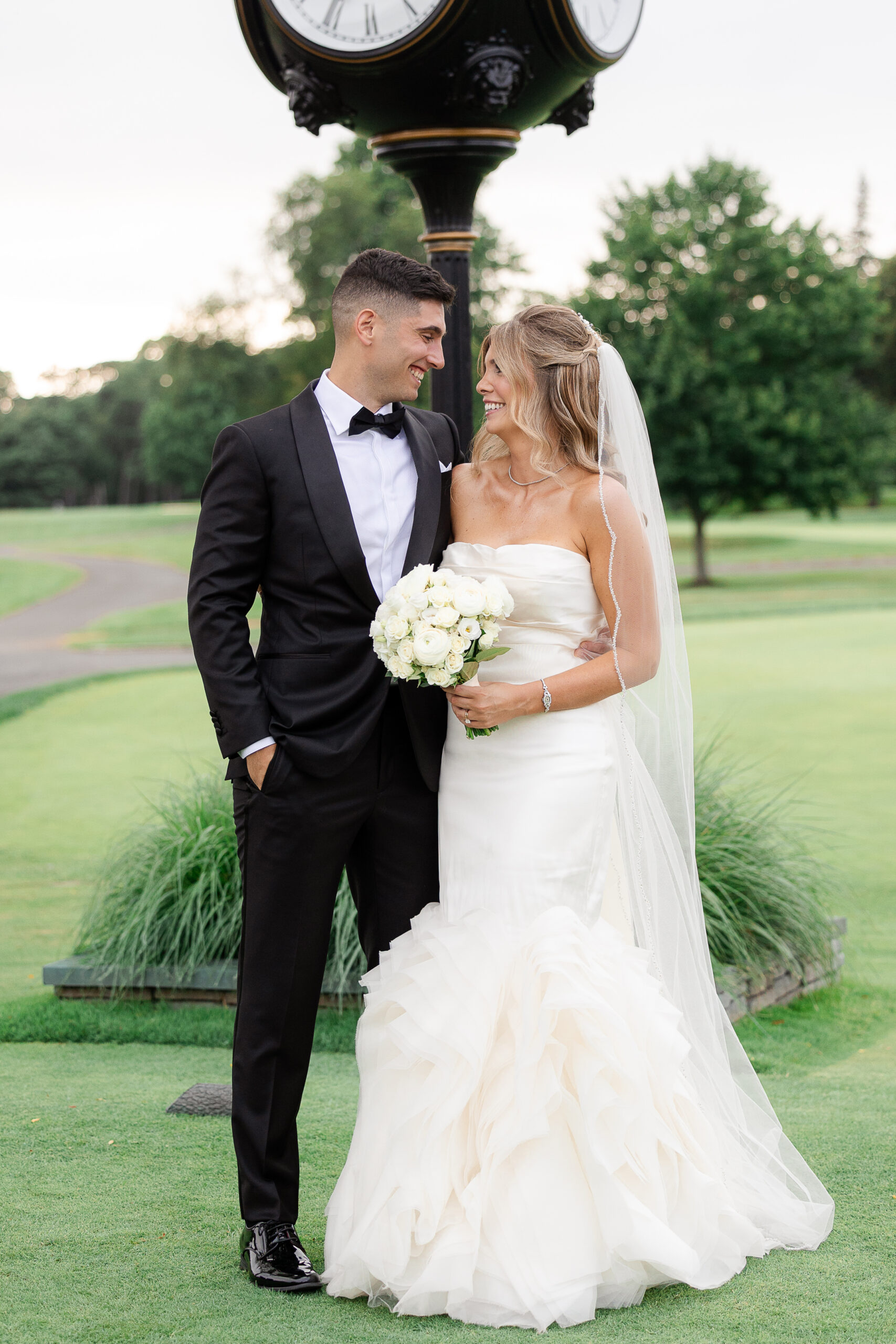 Bride and groom at outdoor country club wedding portraits