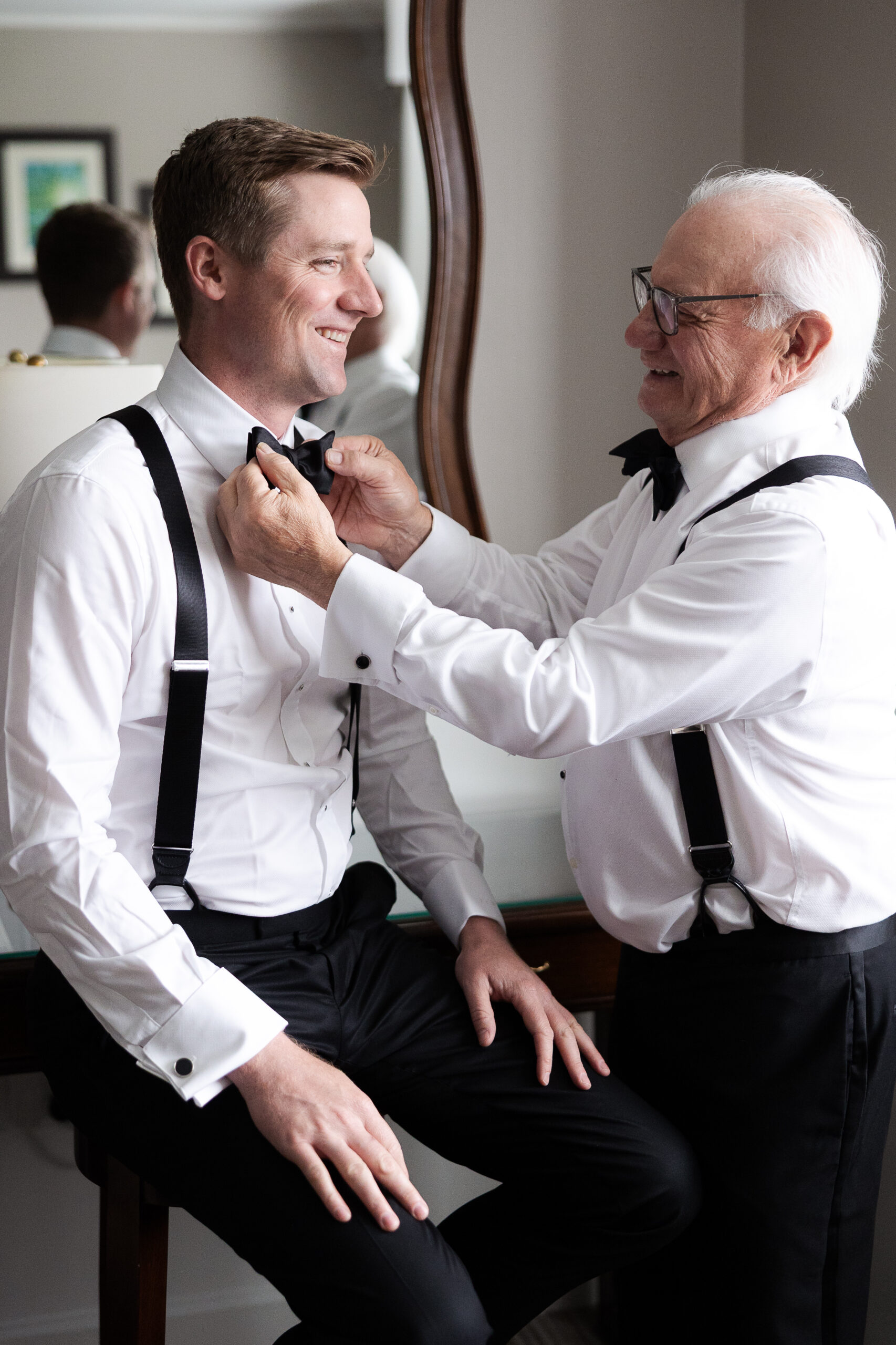 Groom getting dressed at Farmingdale NY wedding day