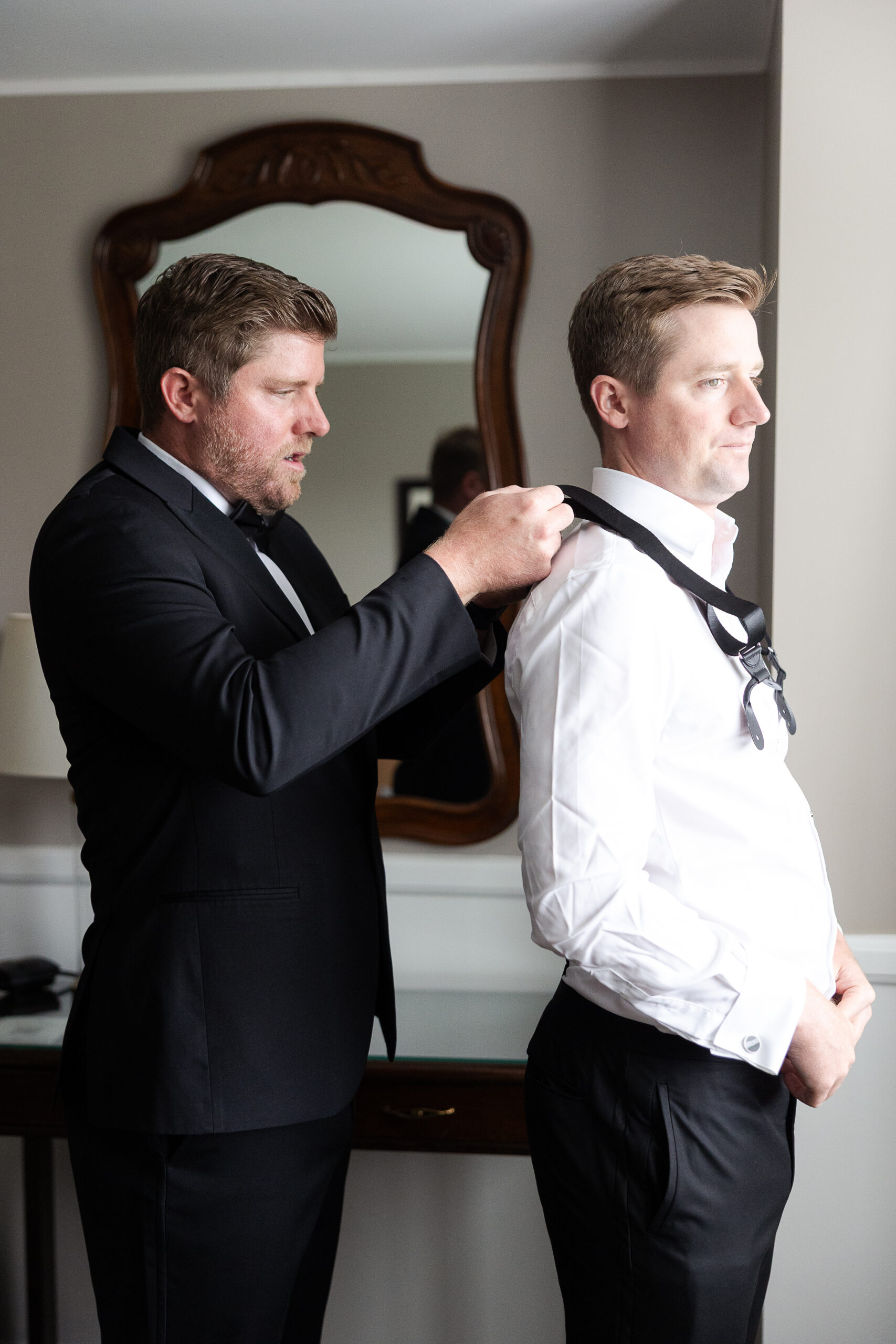Groom getting dressed at Farmingdale NY wedding day
