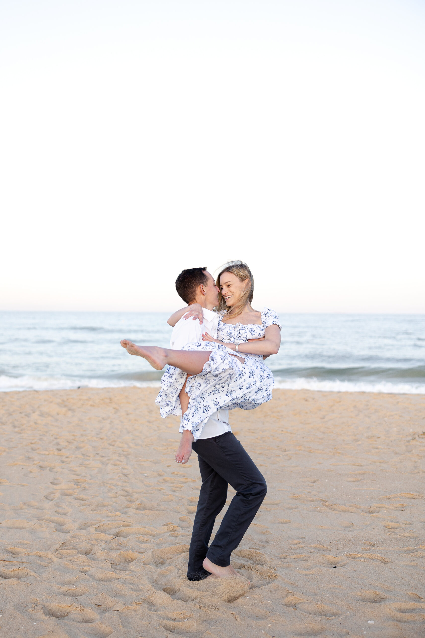 Fun beach engagement portraits at Spring Lake Beach