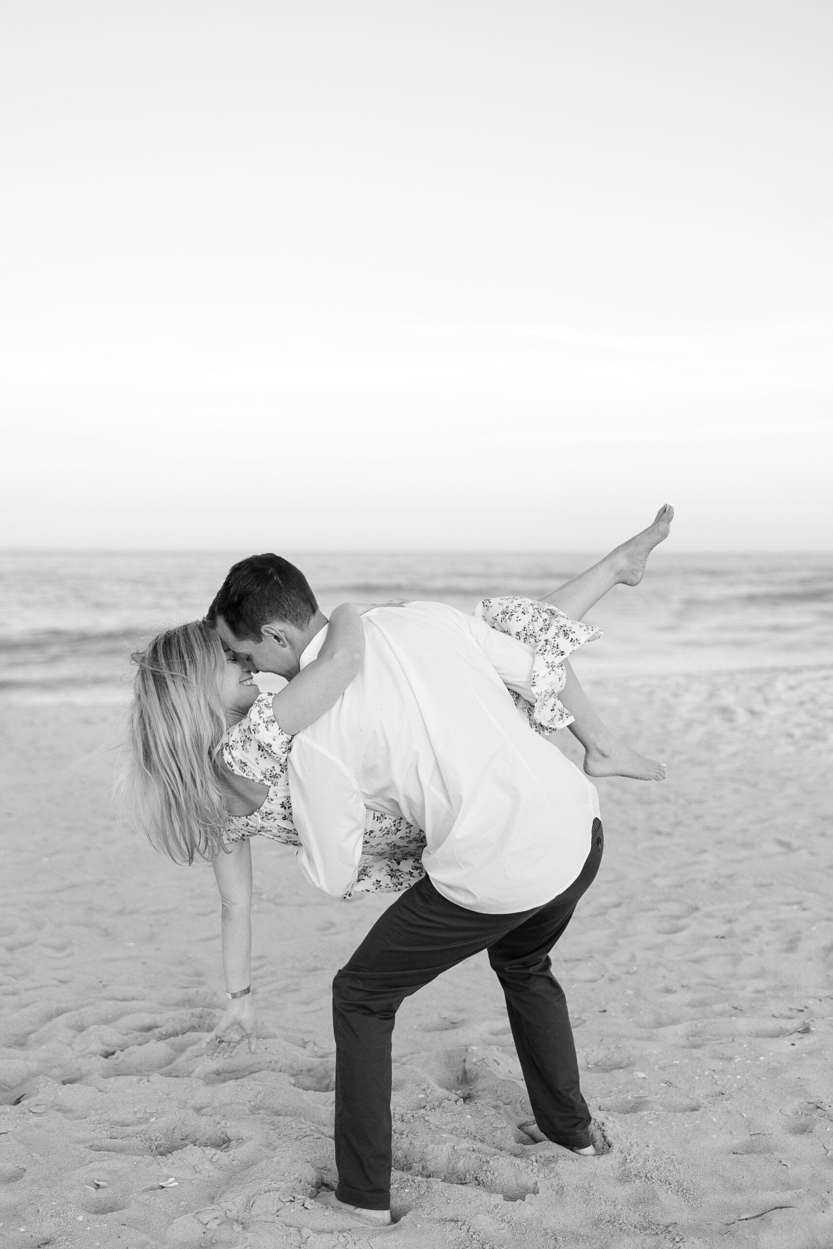 Fun beach engagement portraits at Spring Lake Beach